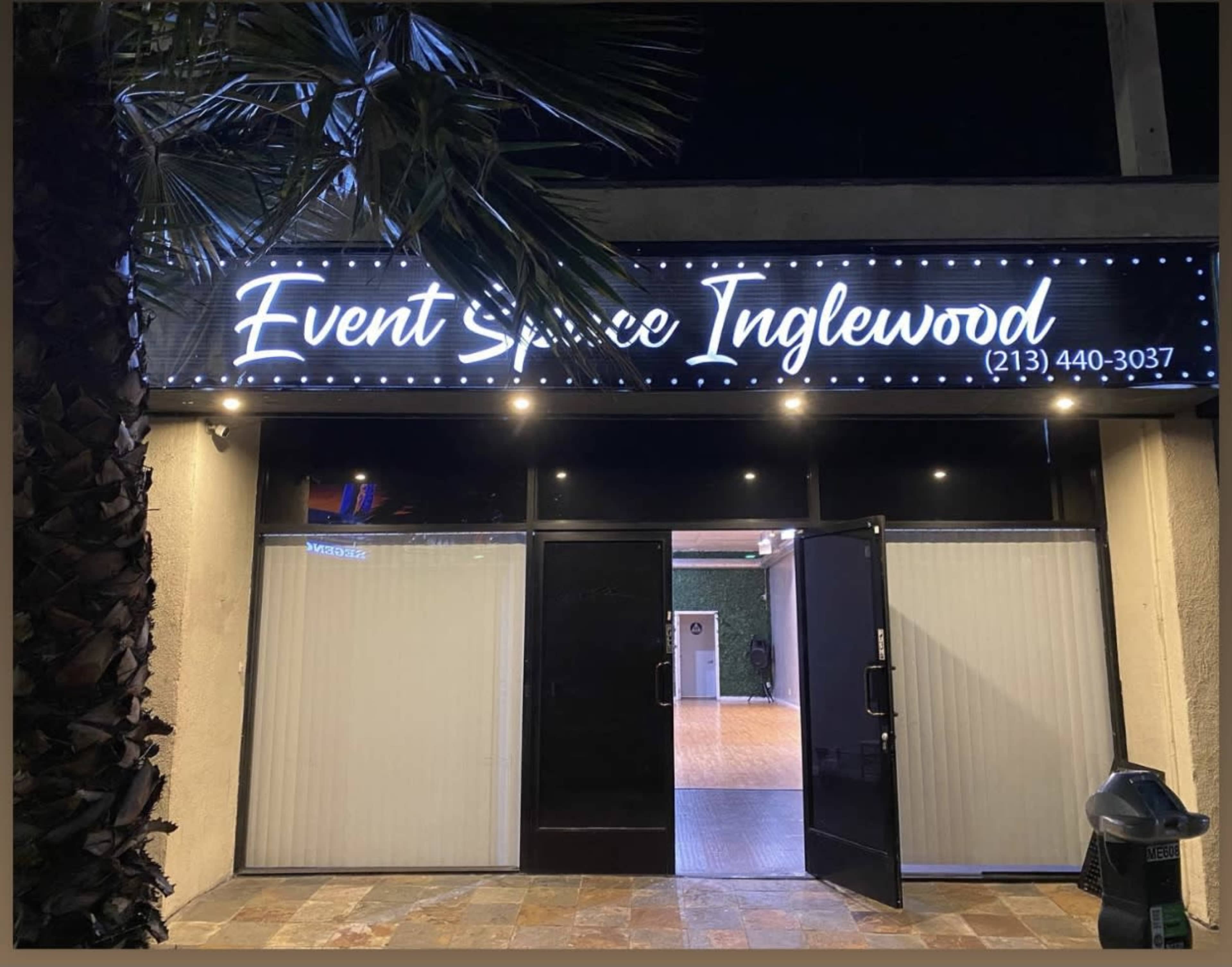 The image shows a venue called "Event Space Inglewood," with its doors open and illuminated signage above.