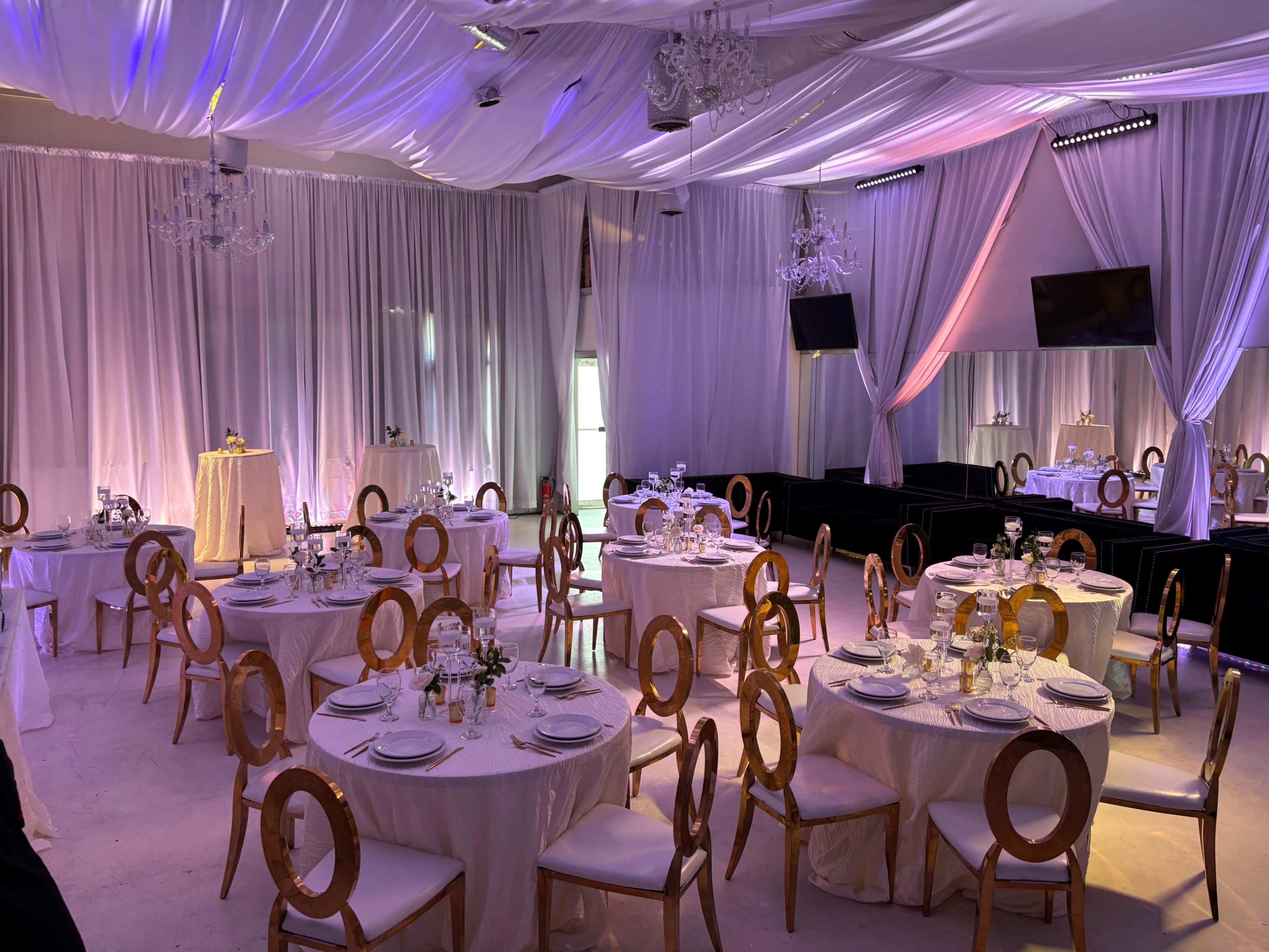 Fully Draped Midtown Lounge & Dinner Party Room with Chandeliers and Uplighting Image in Buckhead, Atlanta, GA