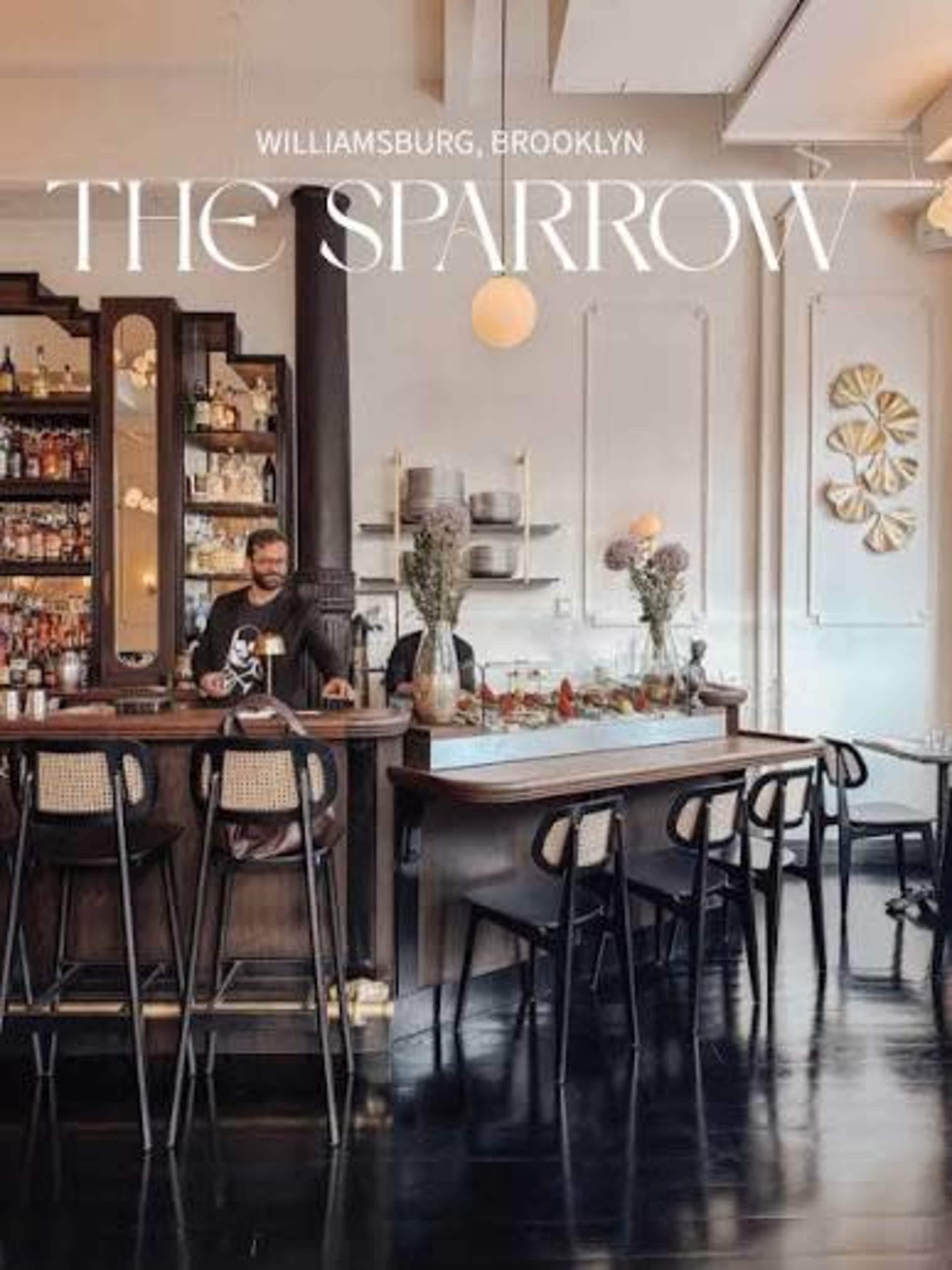 The image shows a stylish bar area in a restaurant named "The Sparrow" located in Williamsburg, Brooklyn, featuring a bartender and modern decor.