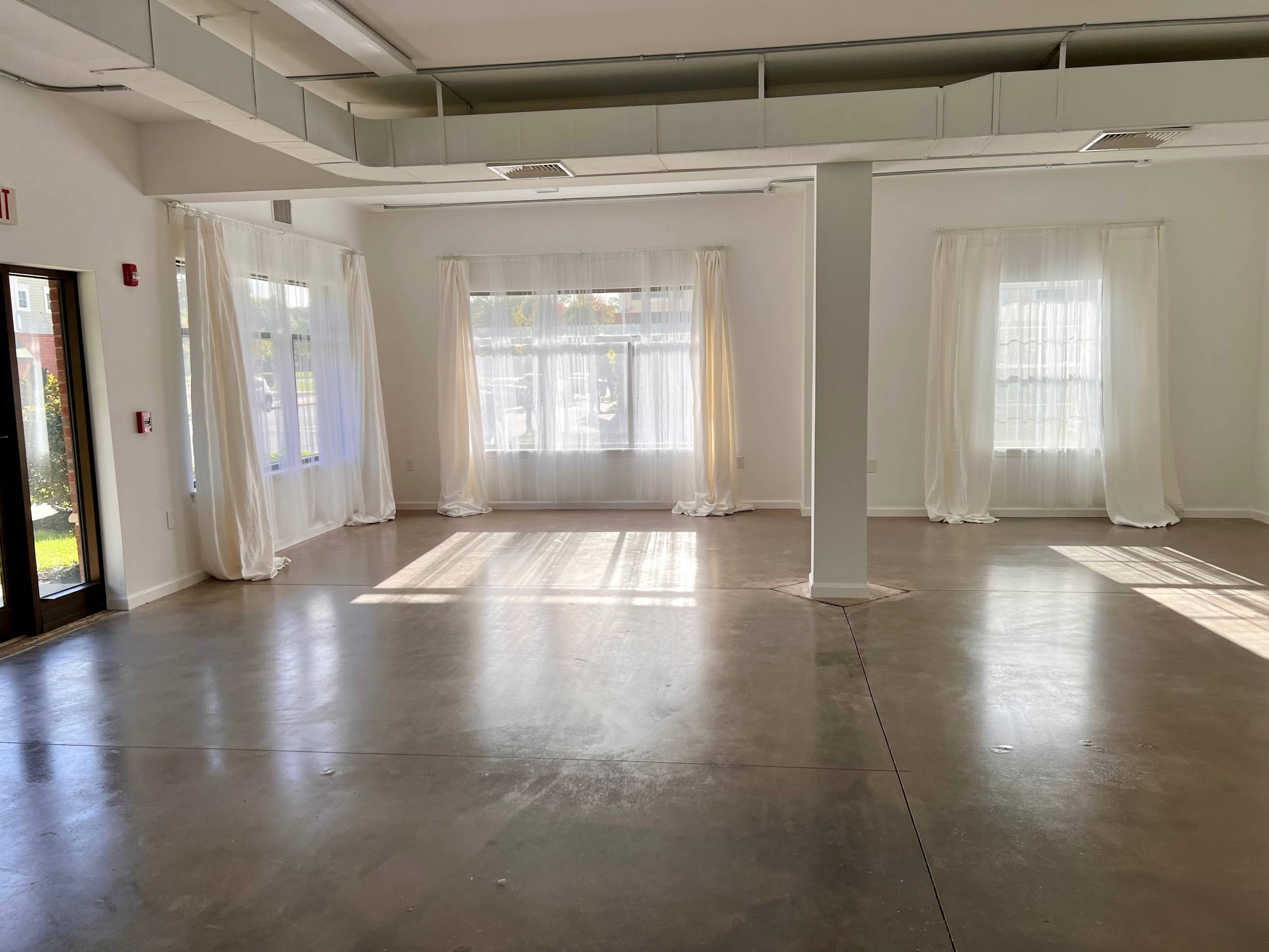 Empty Studio in Residential Neighborhood with Natural Light Image in Brookhaven, Coram, NY