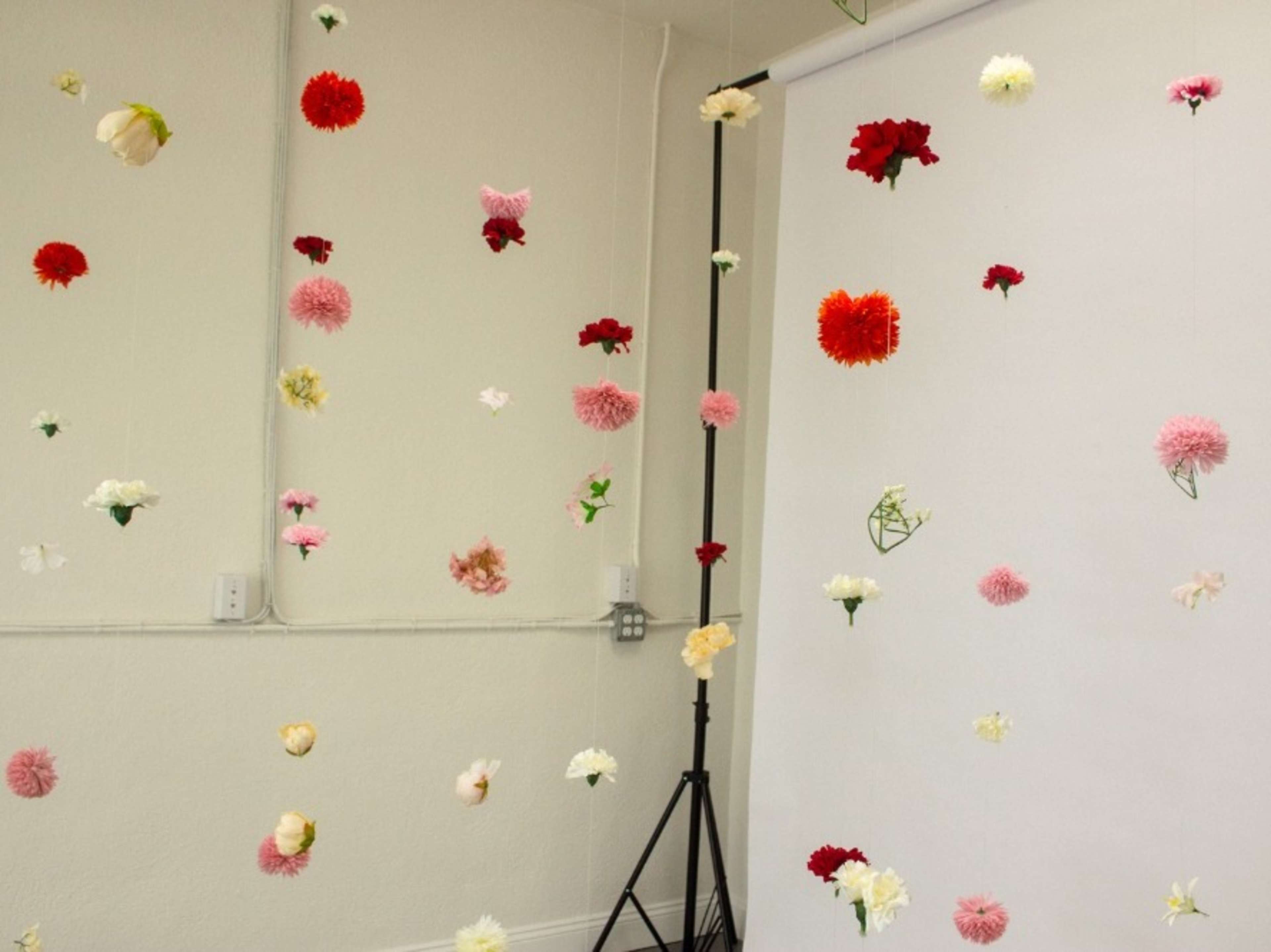 Floating silk flower string backdrop