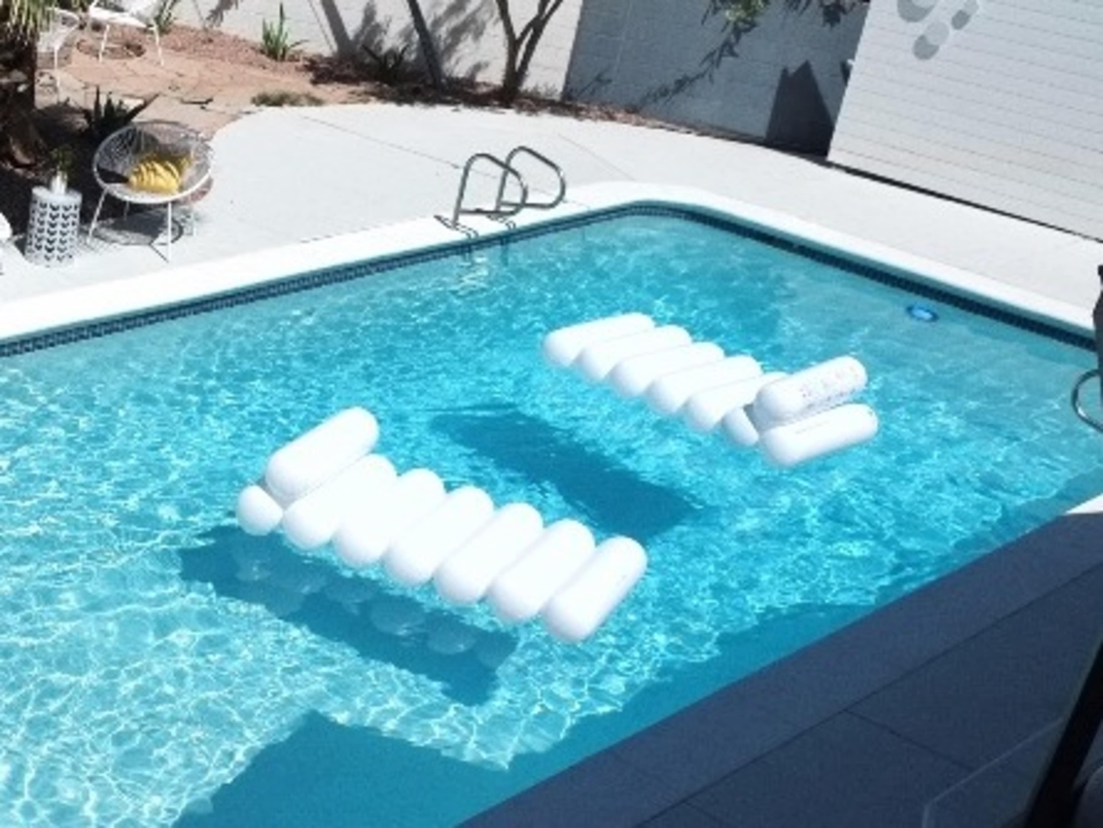 White pool loungers 