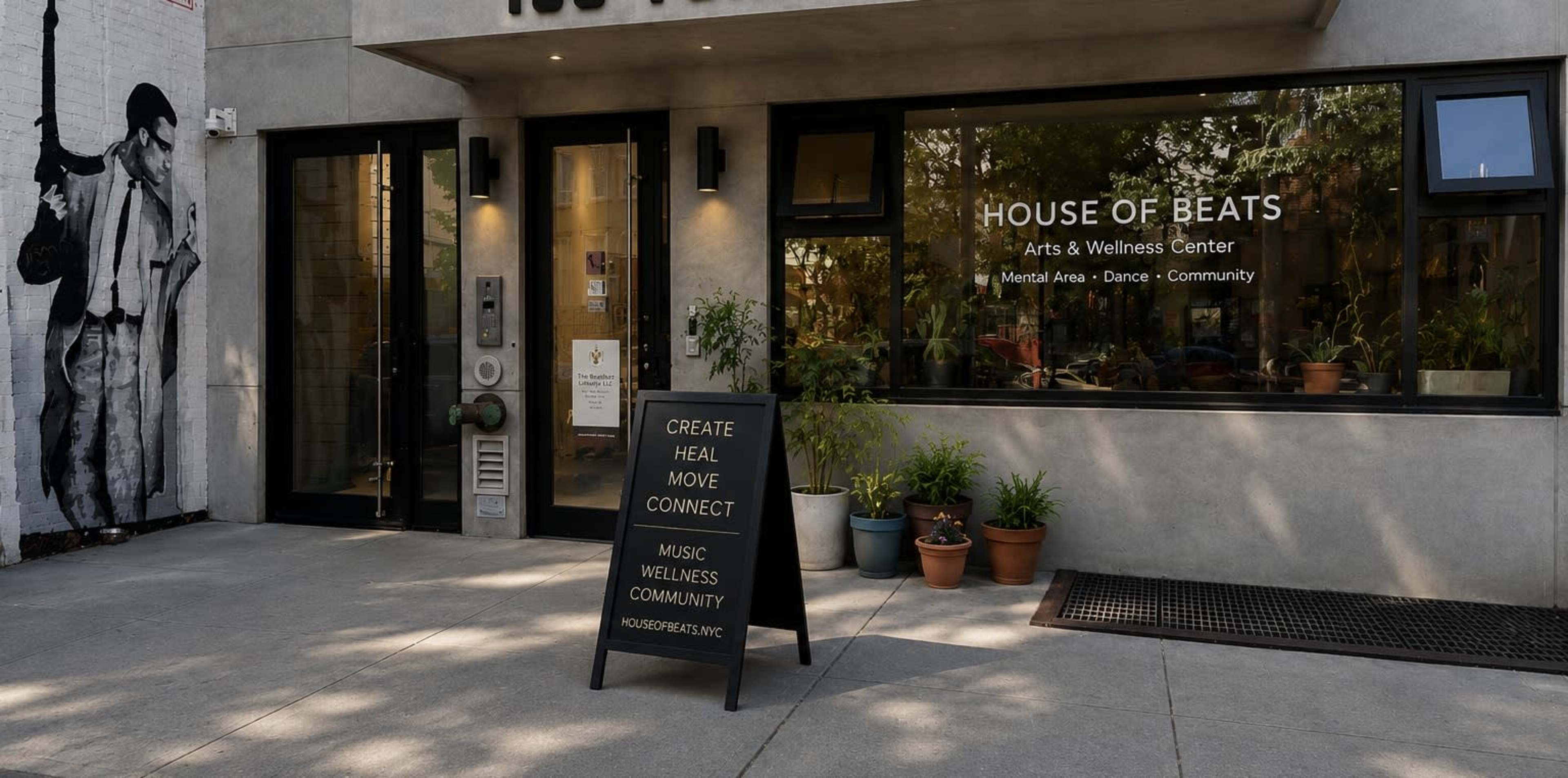 The image shows the entrance of the "House of Beats" arts and wellness center, featuring large windows, potted plants, and a signboard promoting community and wellness activities.