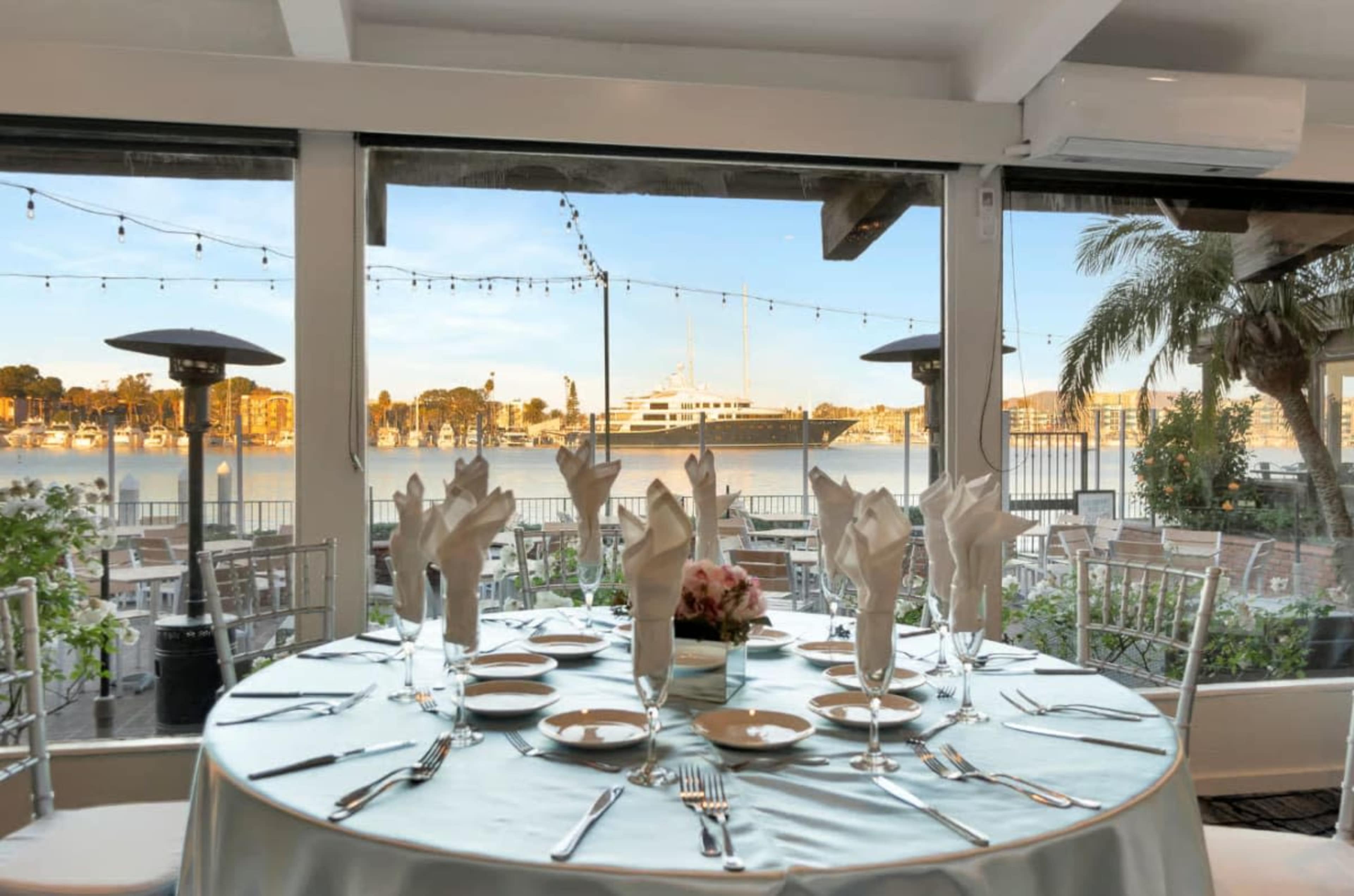 Waterfront Restaurant with Expansive Patio Featuring Views of Sparkling Water, Yachts, and Sealife Image in Marina del Rey, Marina Del Rey, CA