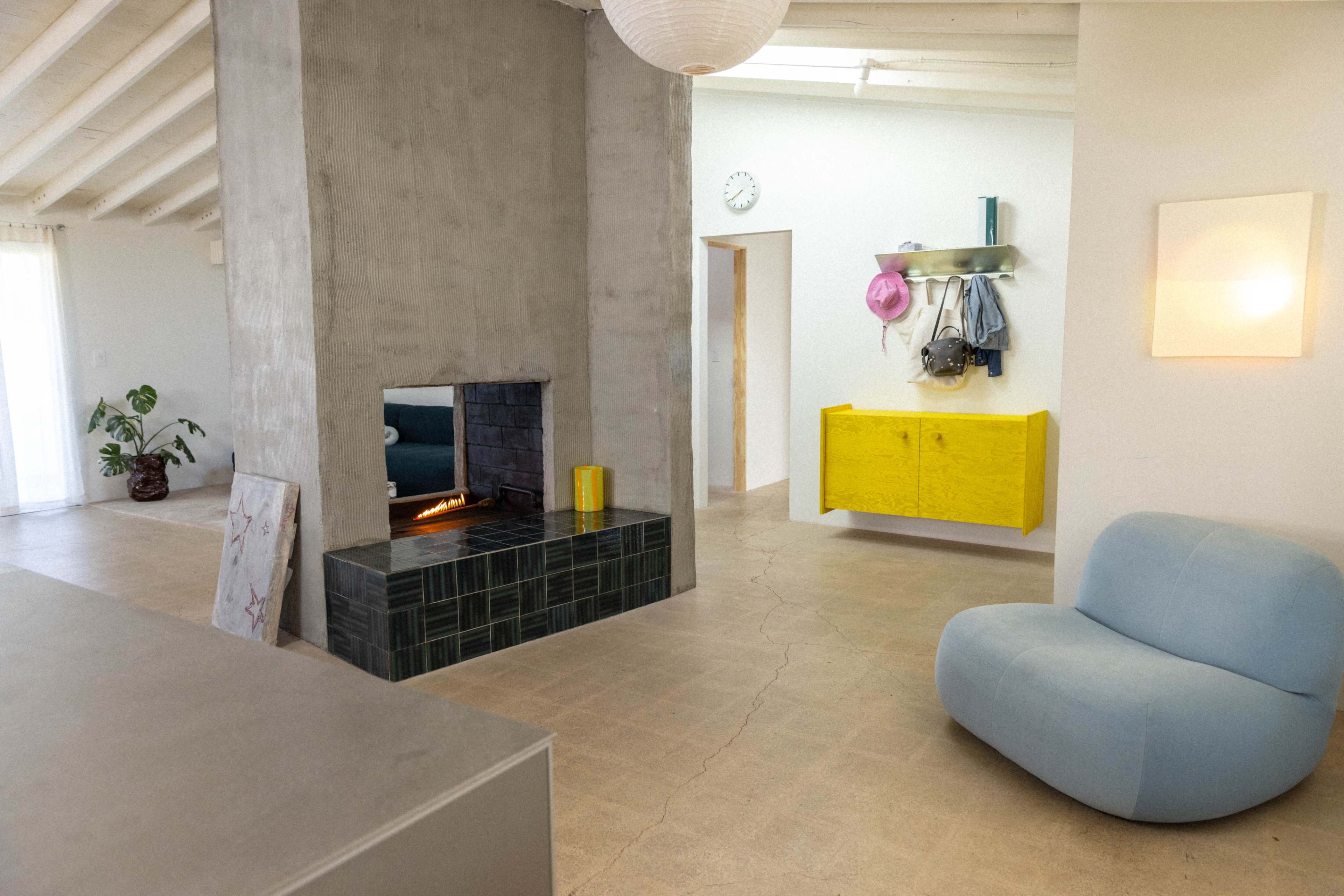 Naturally lit Coastal Ranch with danish kitchen, stainless steel and colorful plywood furniture Image in College Park, Costa Mesa, CA