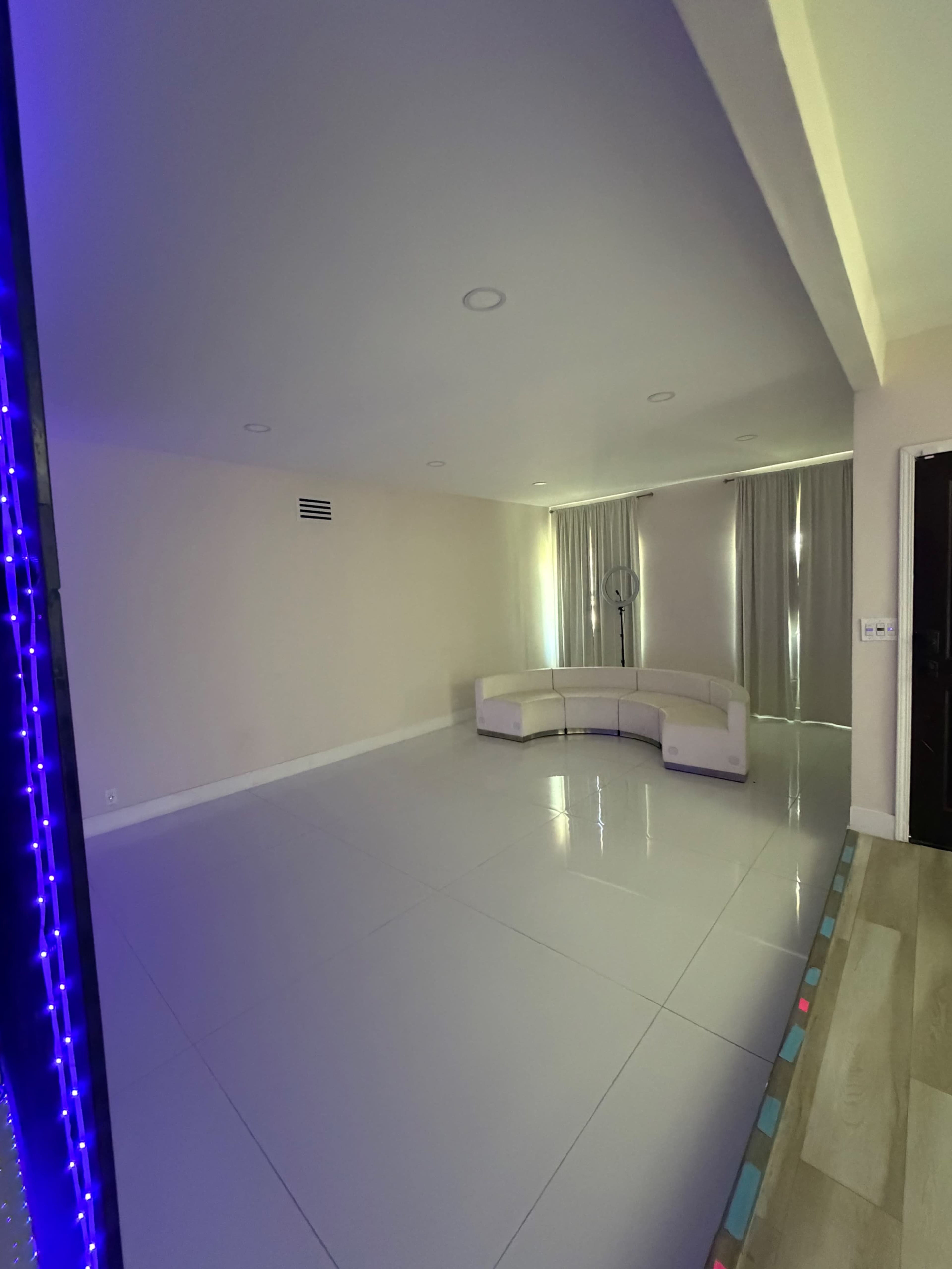 Modern White Room with TV Wall Image in The Section 10, Las Vegas, NV