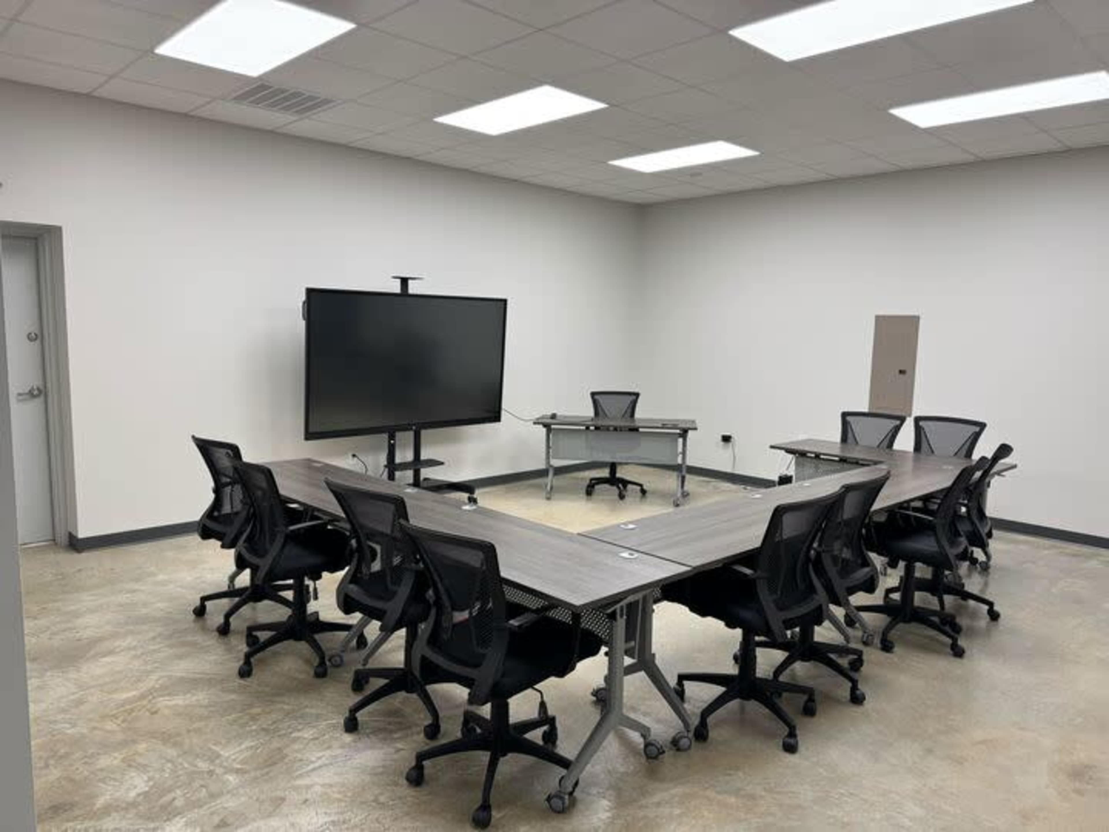 Industrial Boardroom | Seats 12 | 86" Smart Board Image in Conroy Park, Manchaca, TX