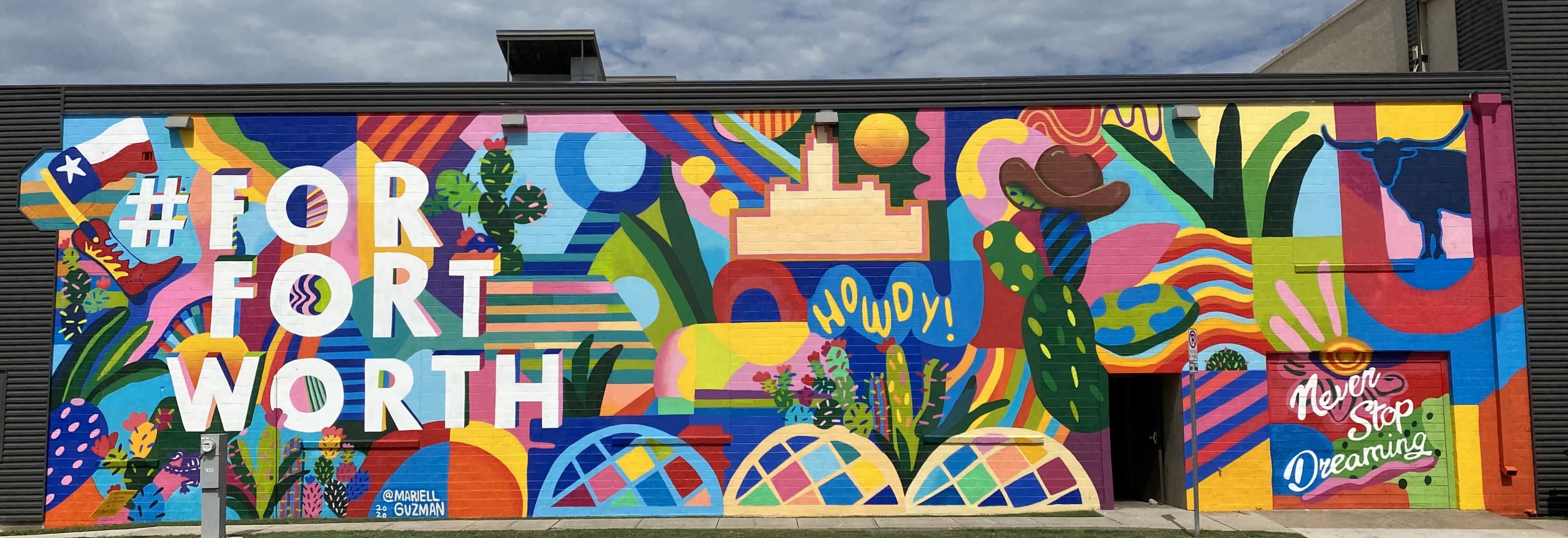 A colorful mural featuring abstract shapes and vibrant patterns with the text "#FOR FORT WORTH" prominently displayed.