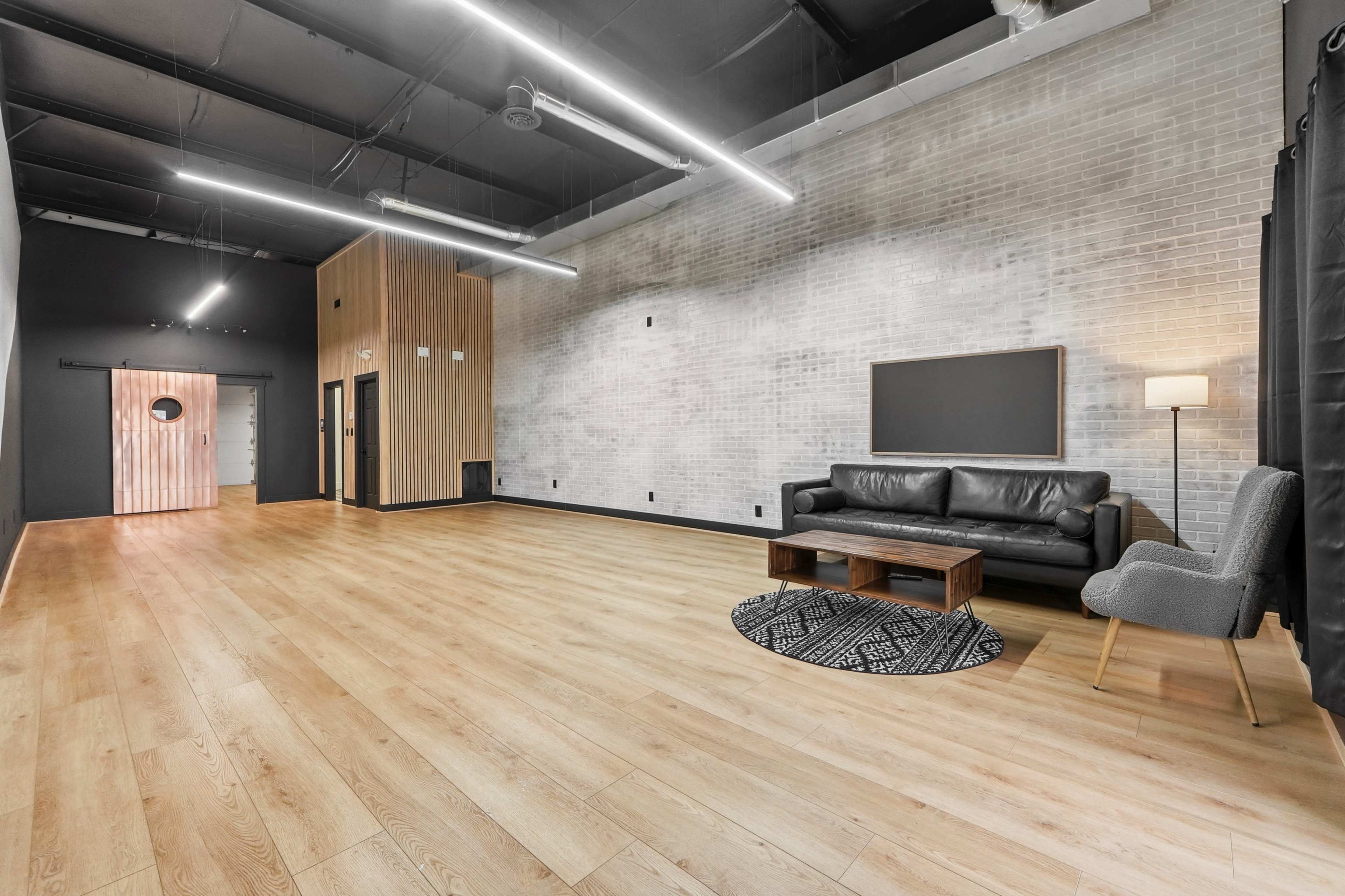 Urban Studio with Modern Wood & Brick Design in Fort Wayne Image in Washington Township, Fort Wayne, IN