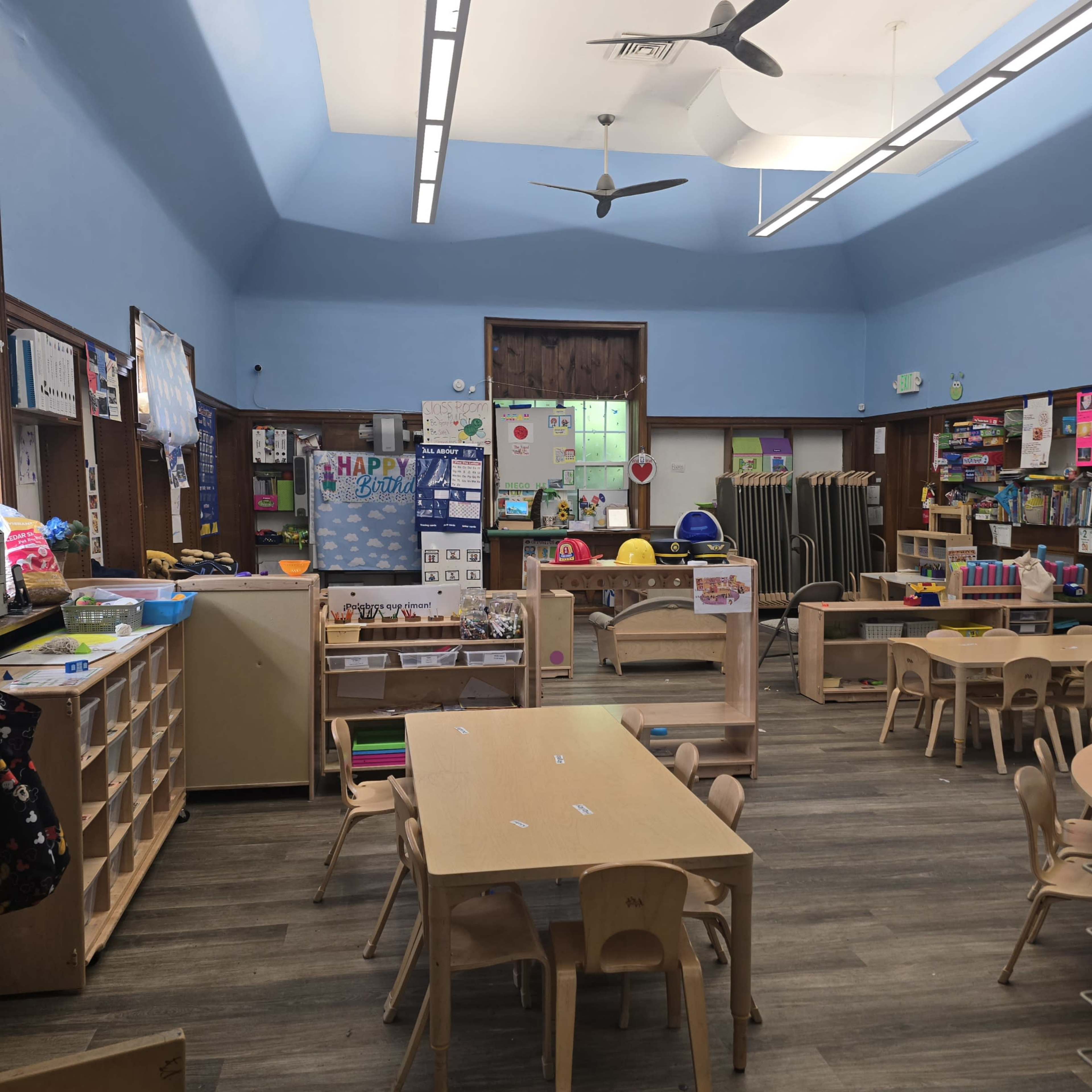 Large preschool classroom setting with kids work and classroom pets. Image in North Township, Hammond, IN