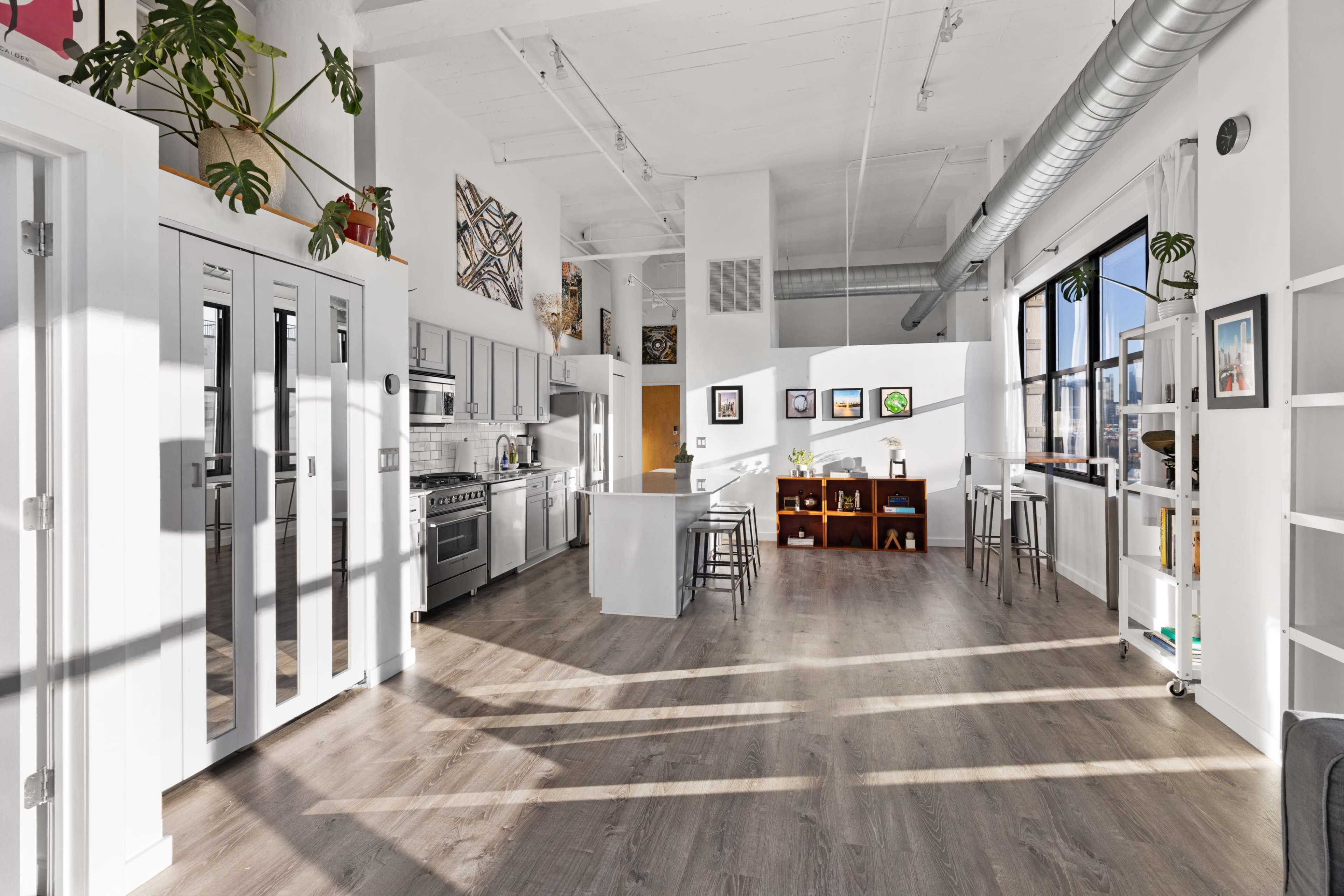 Modern & Historic Loft w/ 20ft Ceilings, South+East Facing Windows, Skyline Views, and Private Balcony Image in Near West Side, Chicago, IL
