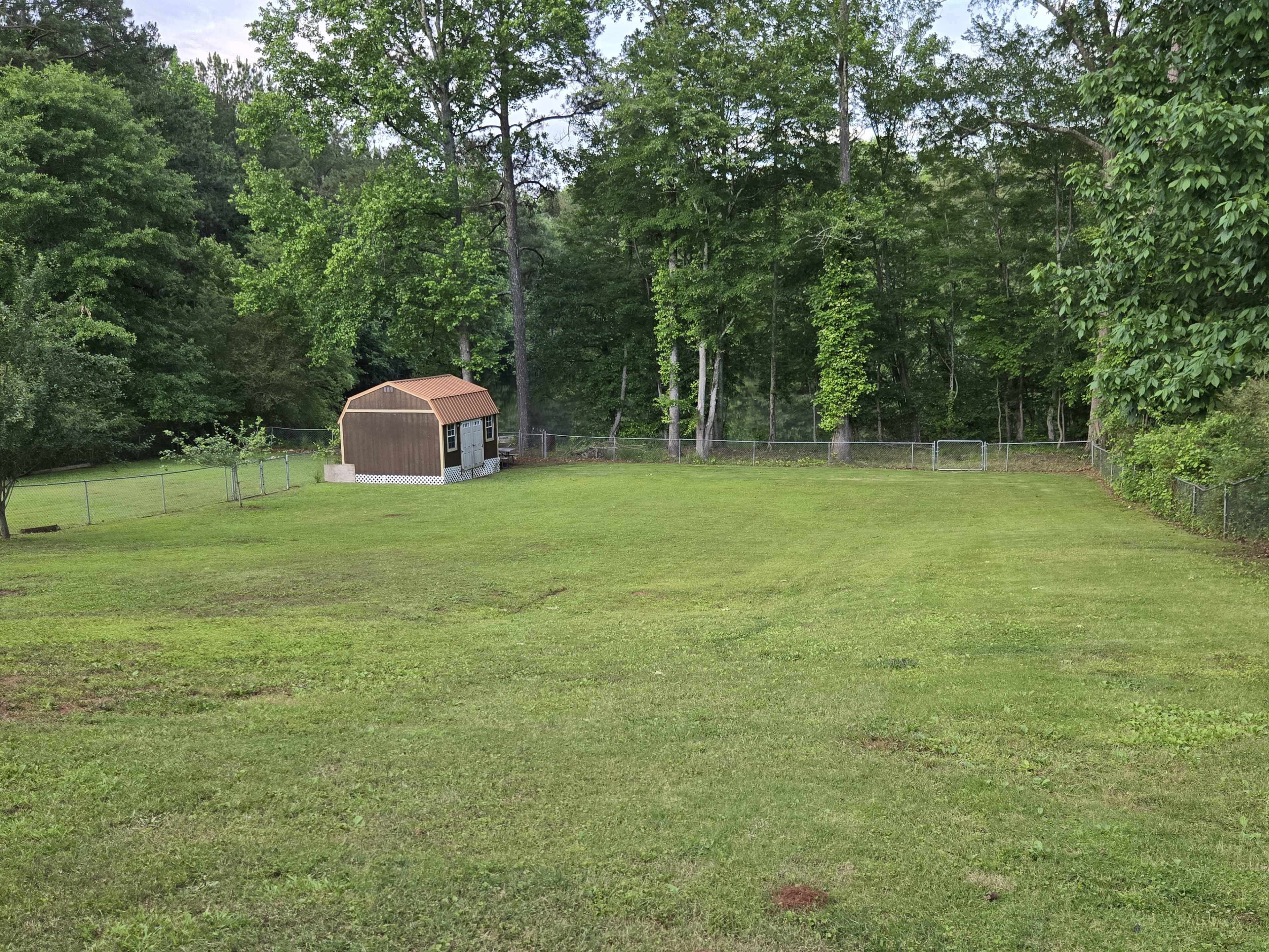 Large backyard with pond view Image in , Stockbridge, GA