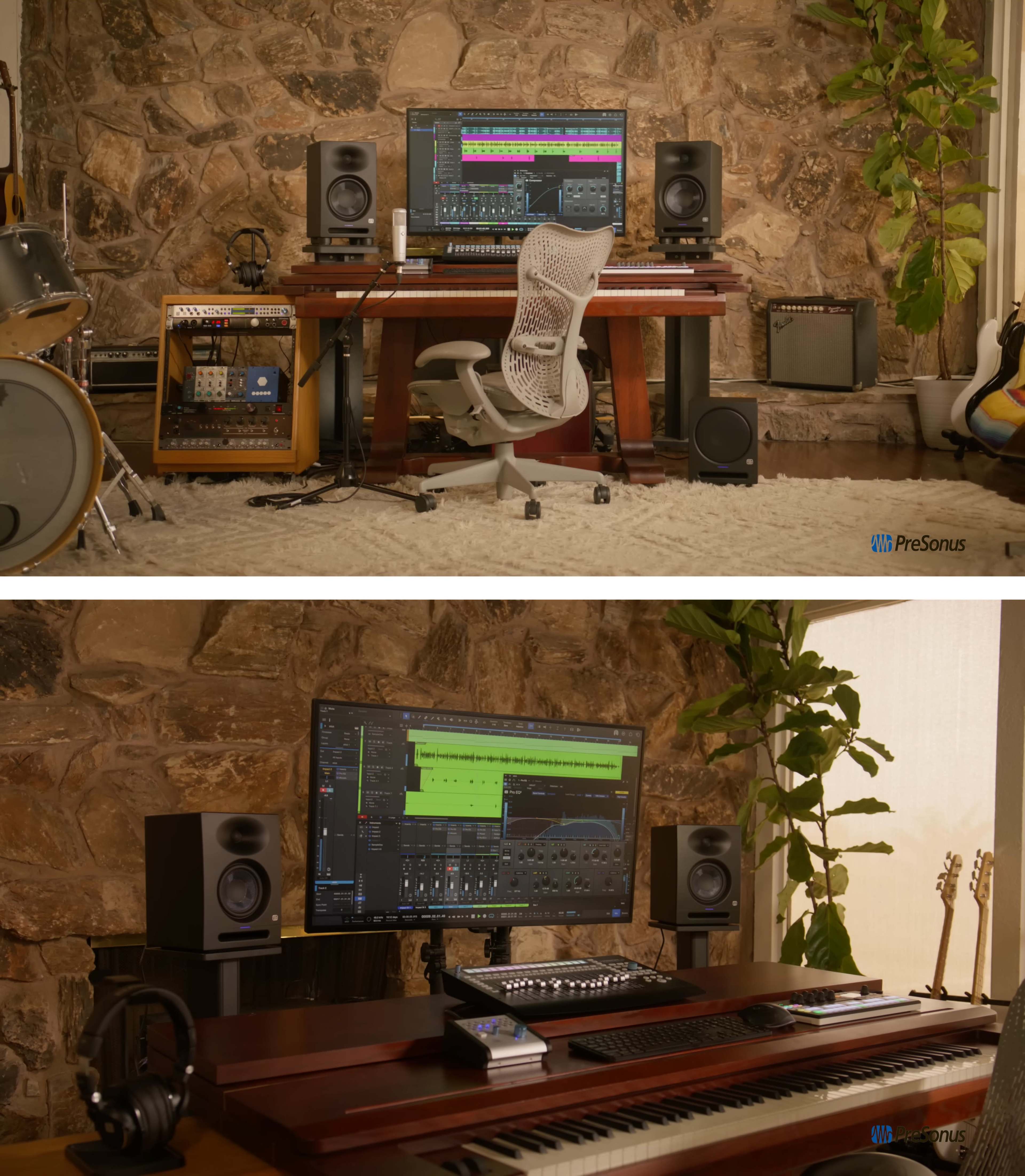 A home recording studio featuring a wooden desk with a computer monitor, audio speakers, a keyboard, and musical instruments against a stone wall backdrop.
