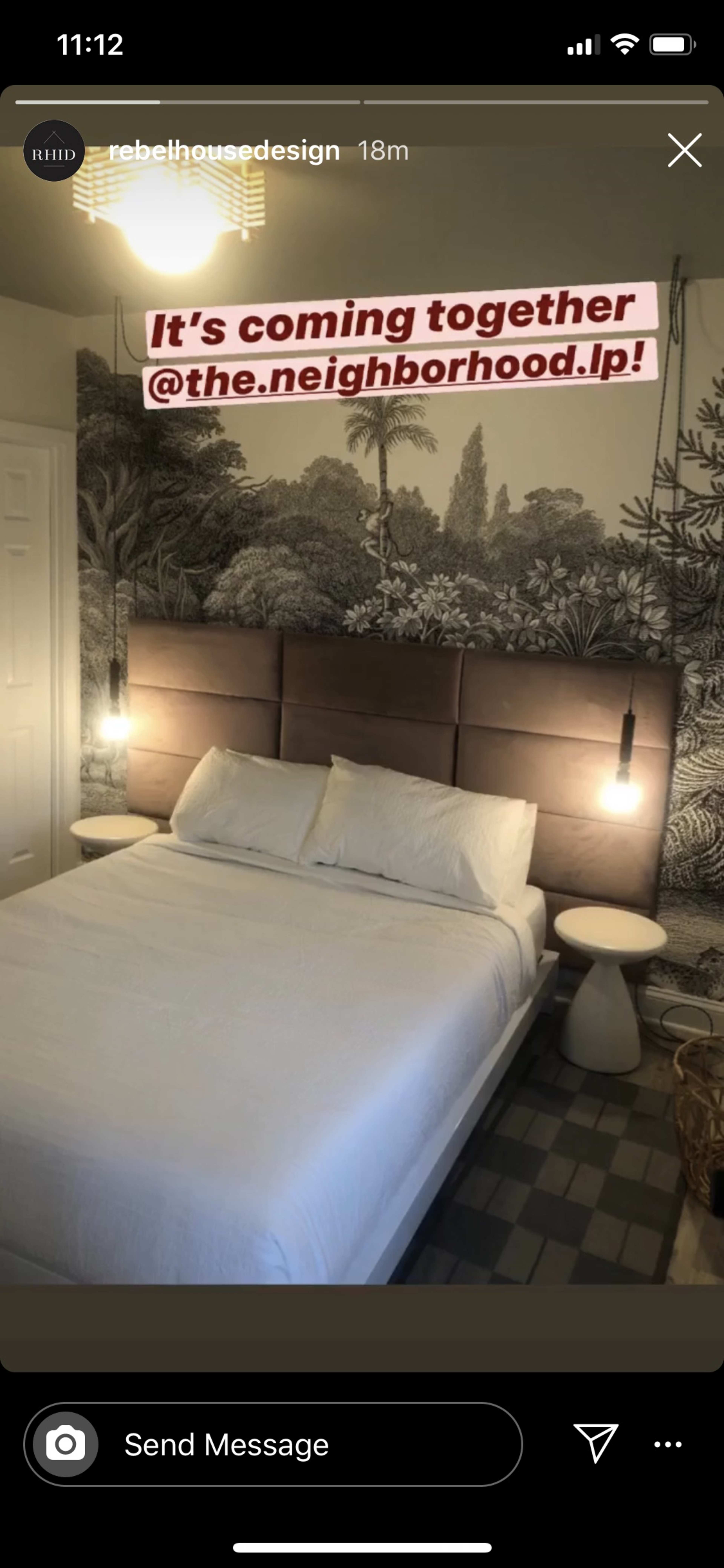 The image shows a bedroom with a large bed and a patterned wall mural, accompanied by pendant lights on either side.