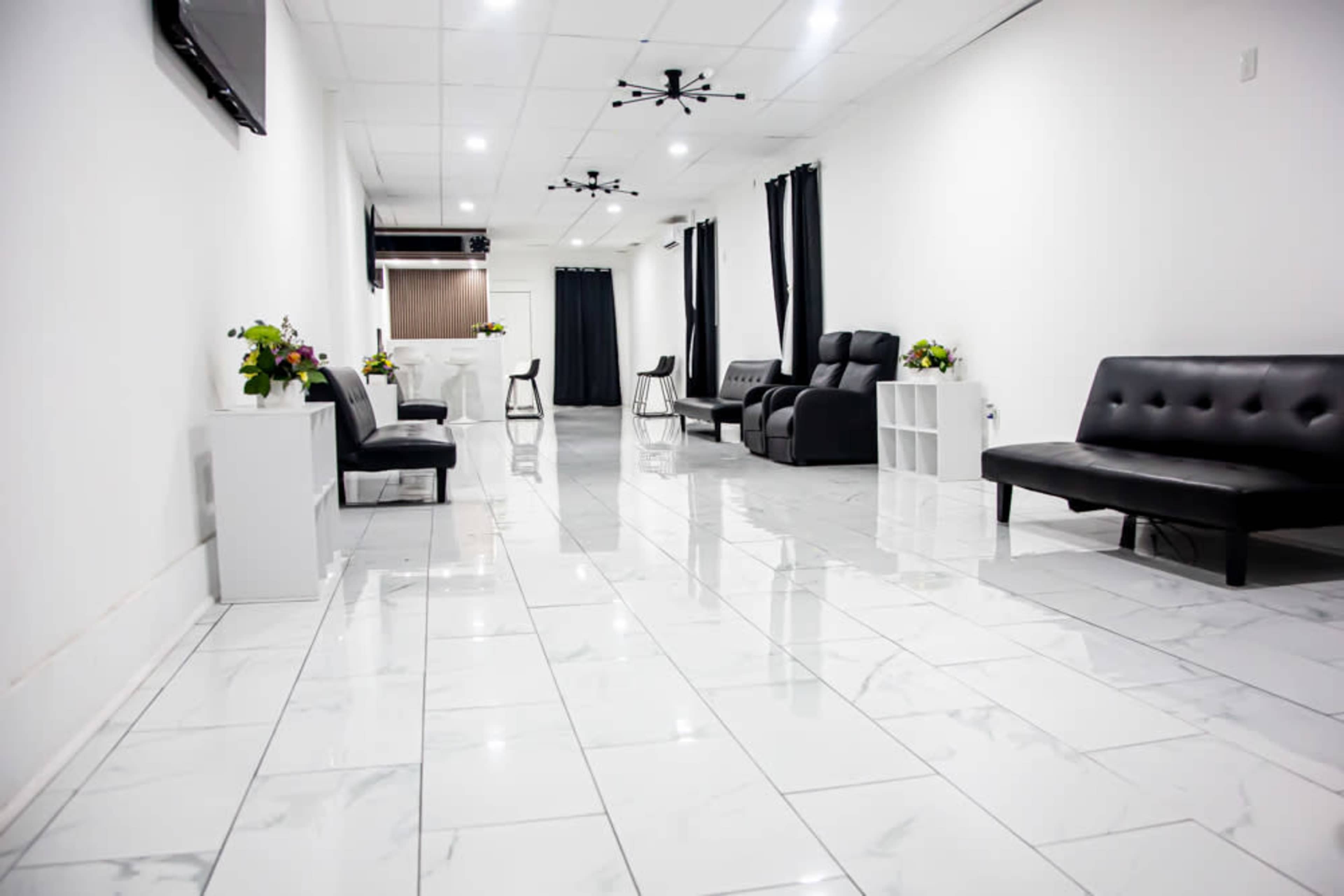 Elegant Black & White Space with Marble Floors and a Wood-Finished Bar Image in Hempstead, Baldwin, NY