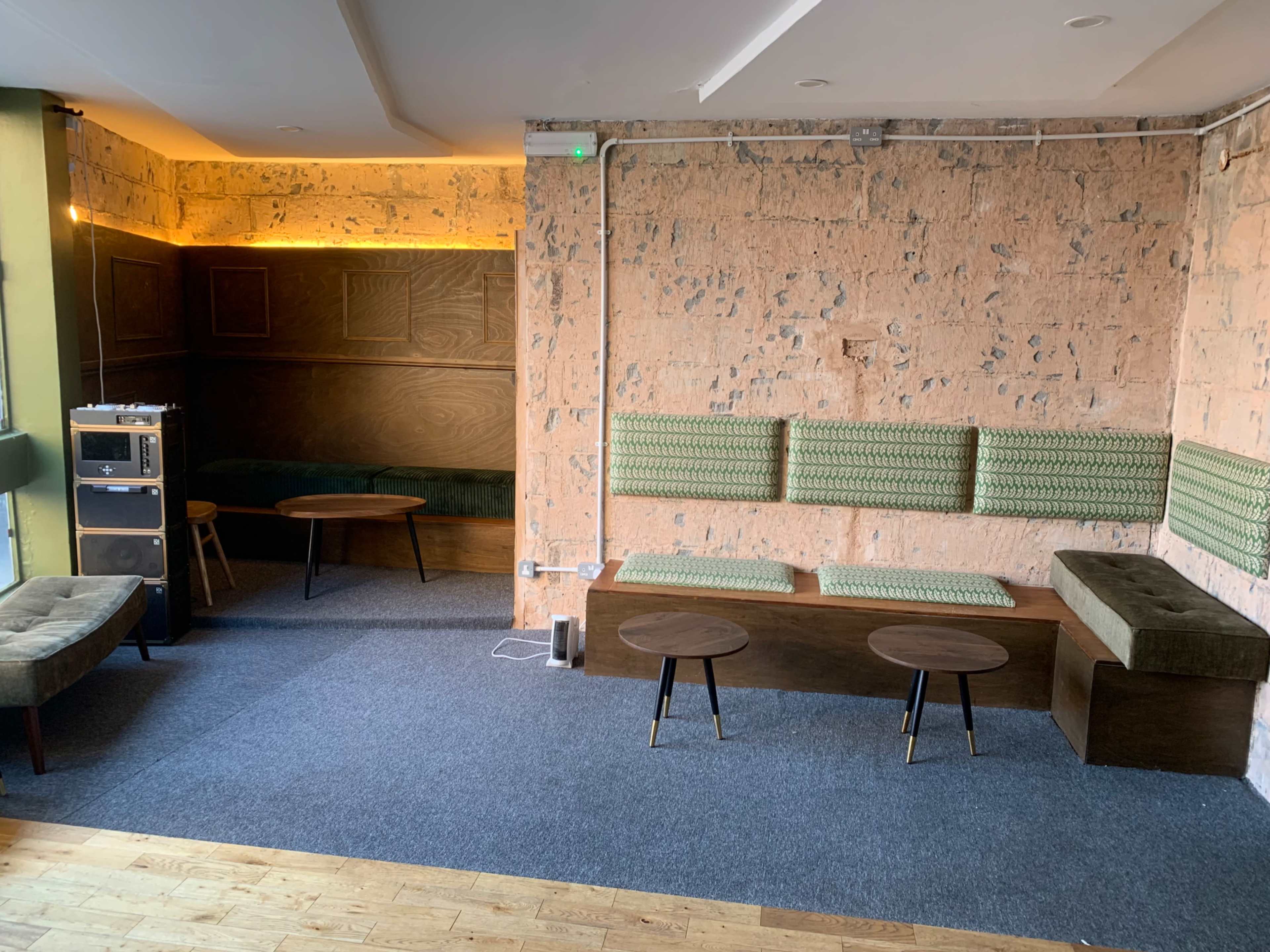 A cool urban first floor cocktail bar and restaurant lounge in a brutalist ex post office building with views over an international street food market Image in Balham, London, ENG