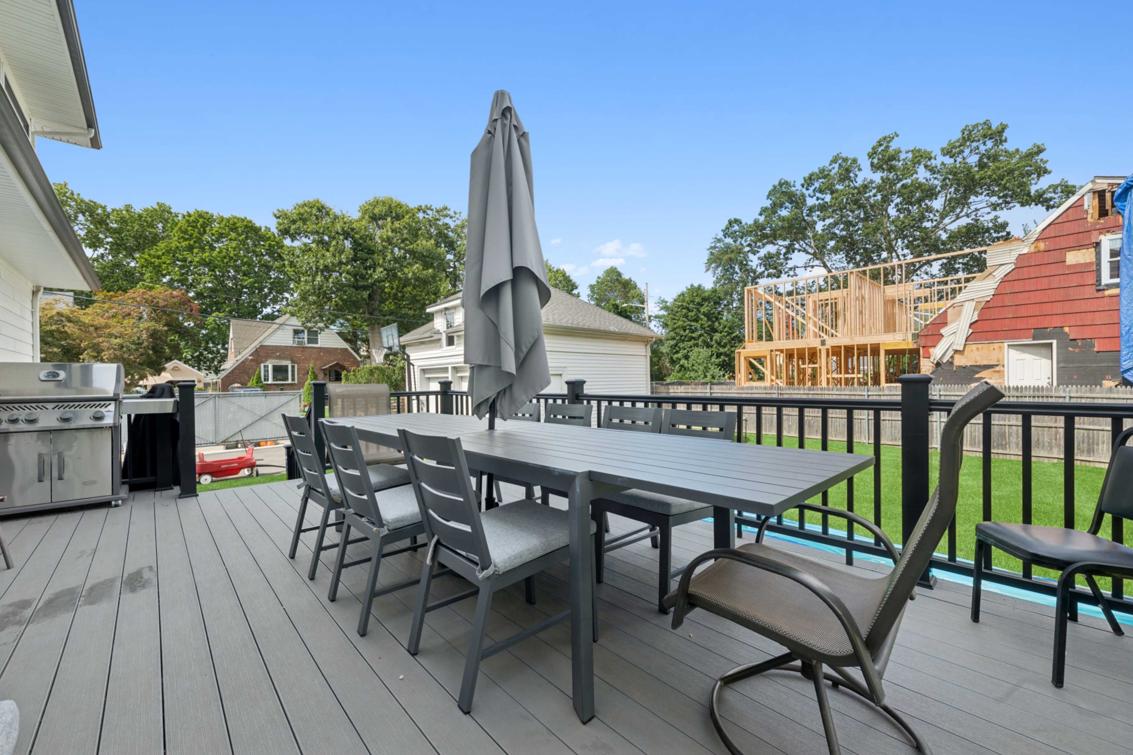 1913 updated and expanded Victorian center hall colonial on 1/3 acre property with wrap around porch. Image in Hempstead, West Hempstead, NY