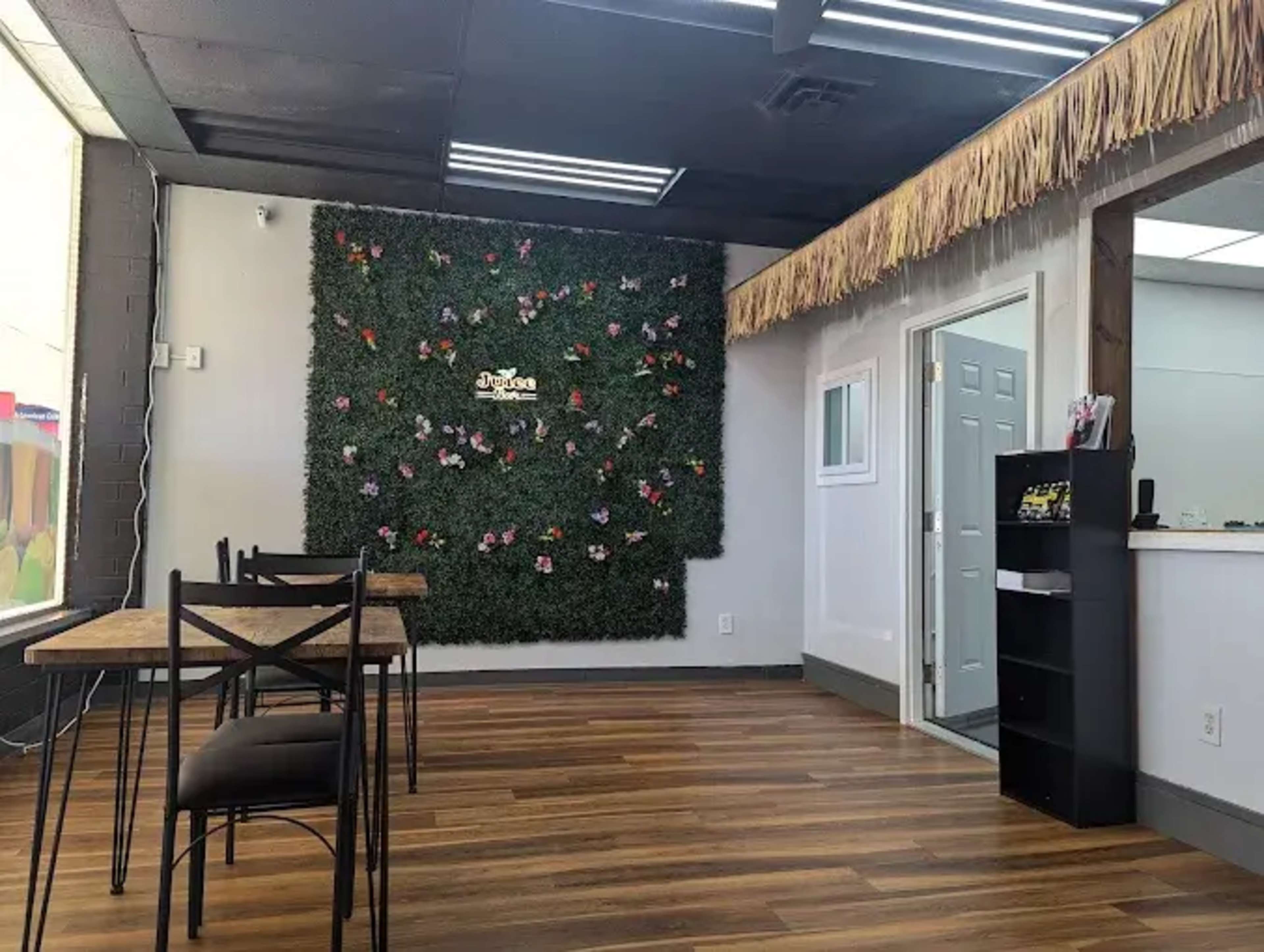 Open-Concept Juice Bar with Wood Bar, Greenery Wall & Café Seating Image in College Park, College Park, GA