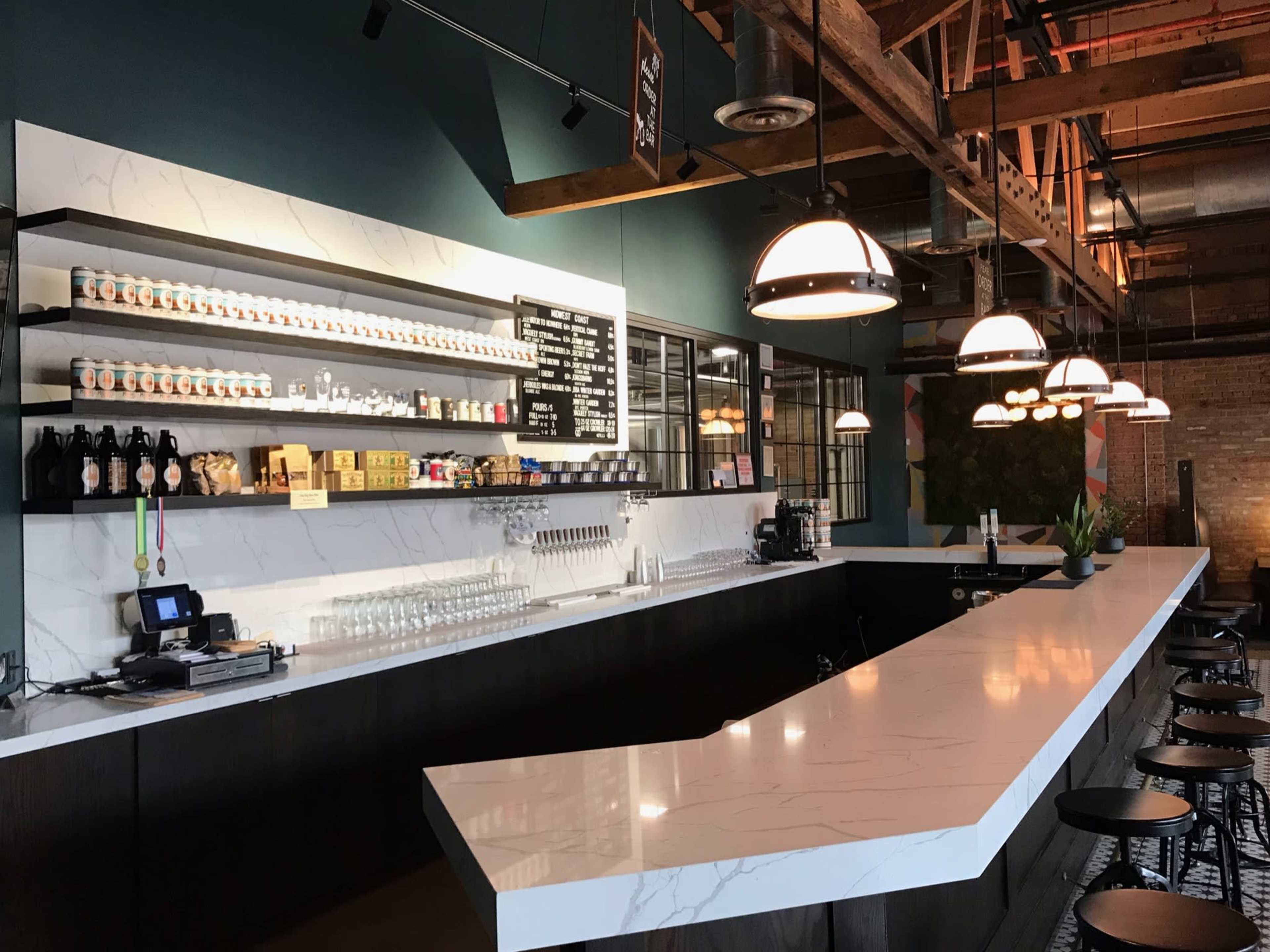 Industrial, exposed brick, wooden bow truss ceiling, brewery, taproom Image in Near West Side, Chicago, IL