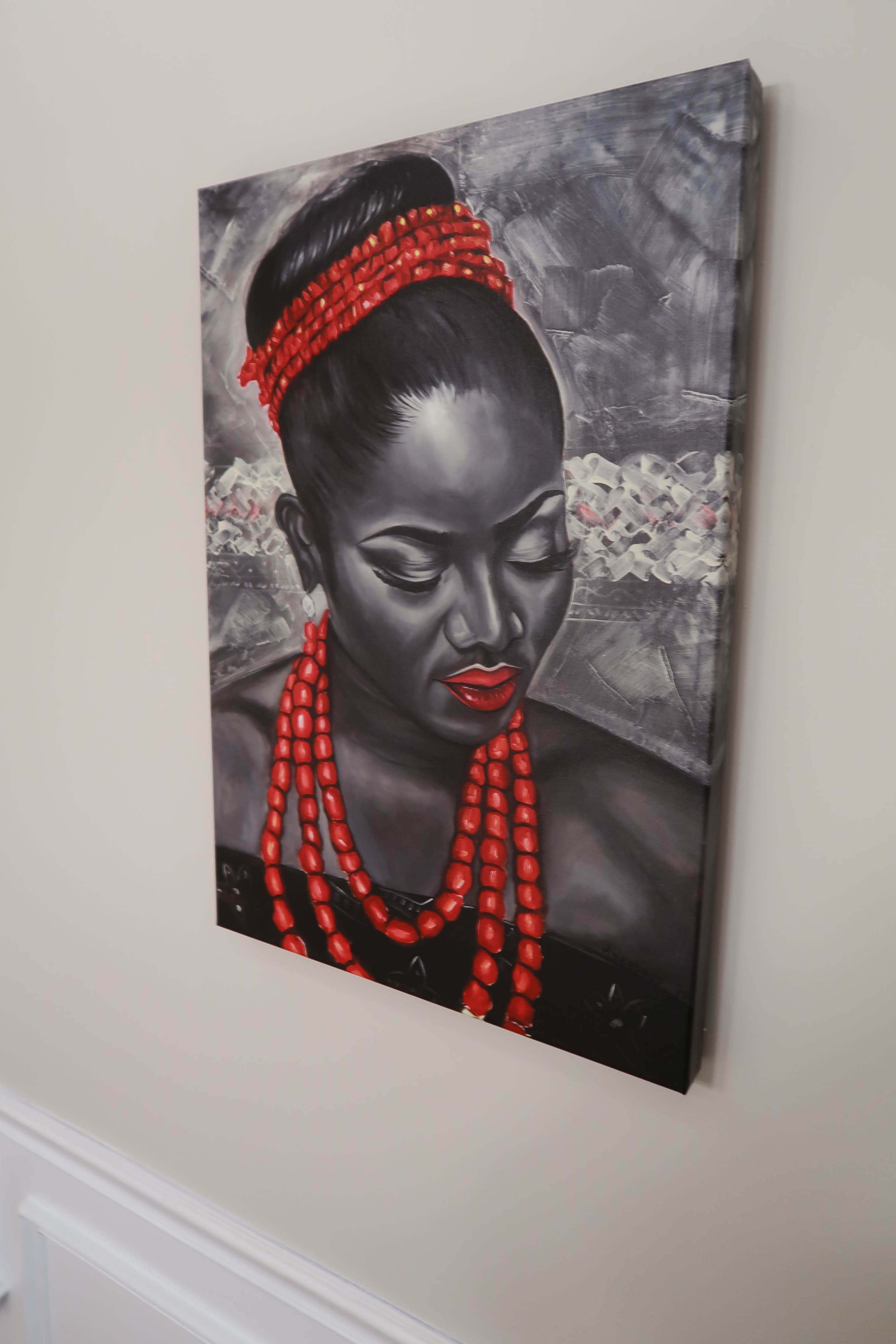 The image features a painting of a woman with dark skin adorned in red necklace beads, set against a textured gray background.