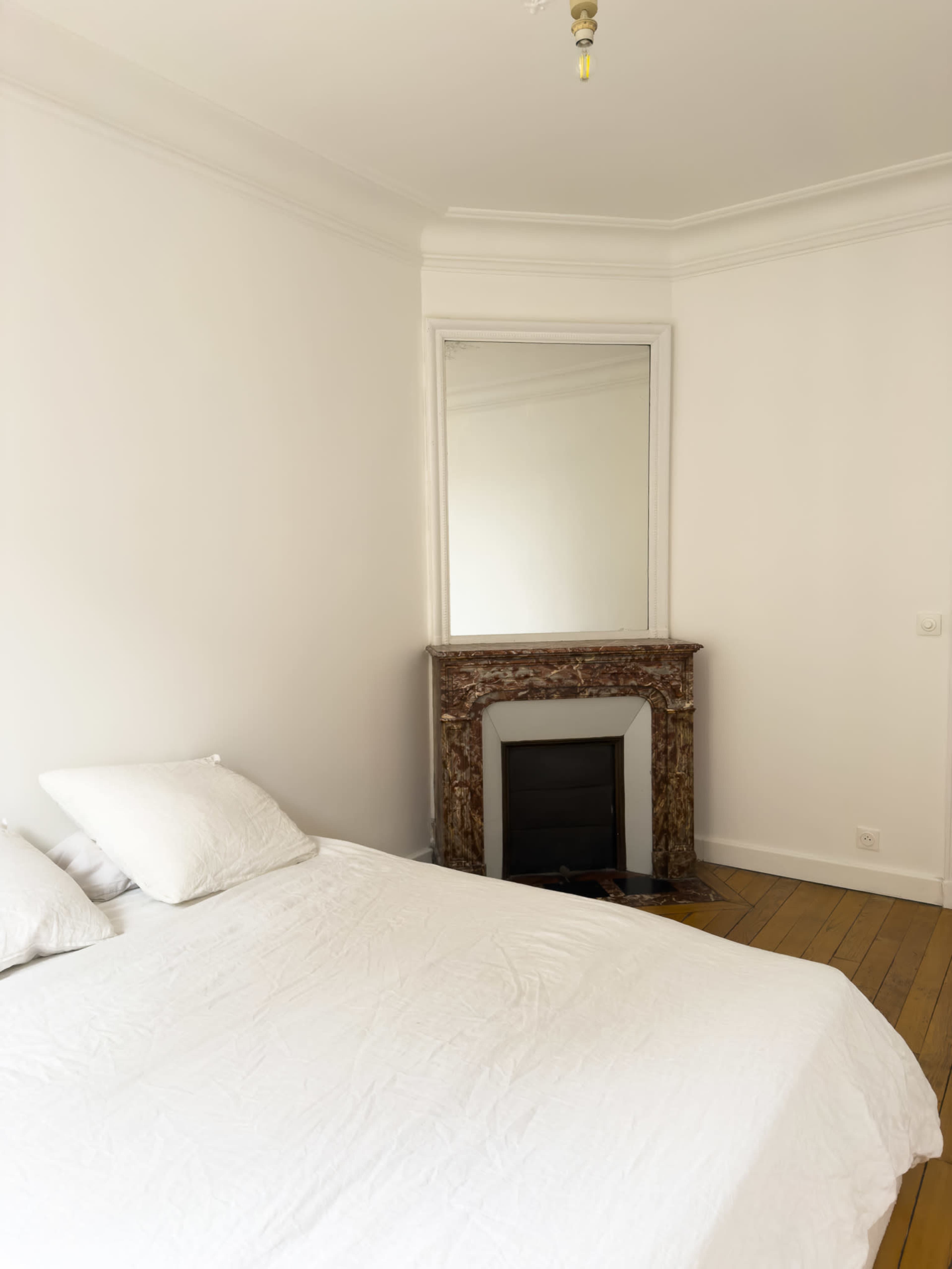 A minimalist, elegant, and bright Haussmannian Haven in the Heart of Paris Image in Clignancourt, Paris, 