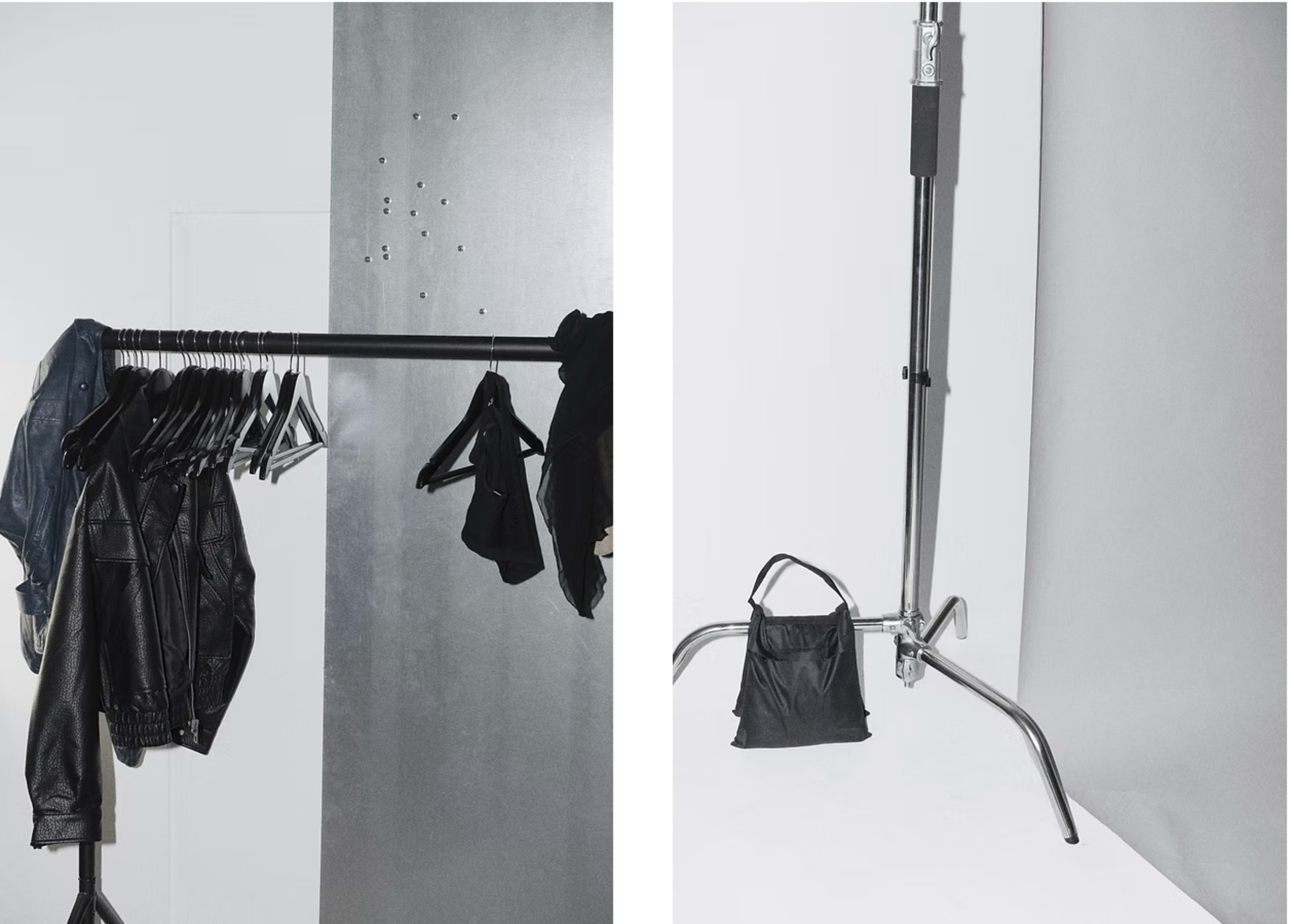 The image features a clothing rack with several leather jackets hanging on it, alongside a backdrop with a stand holding a black bag.