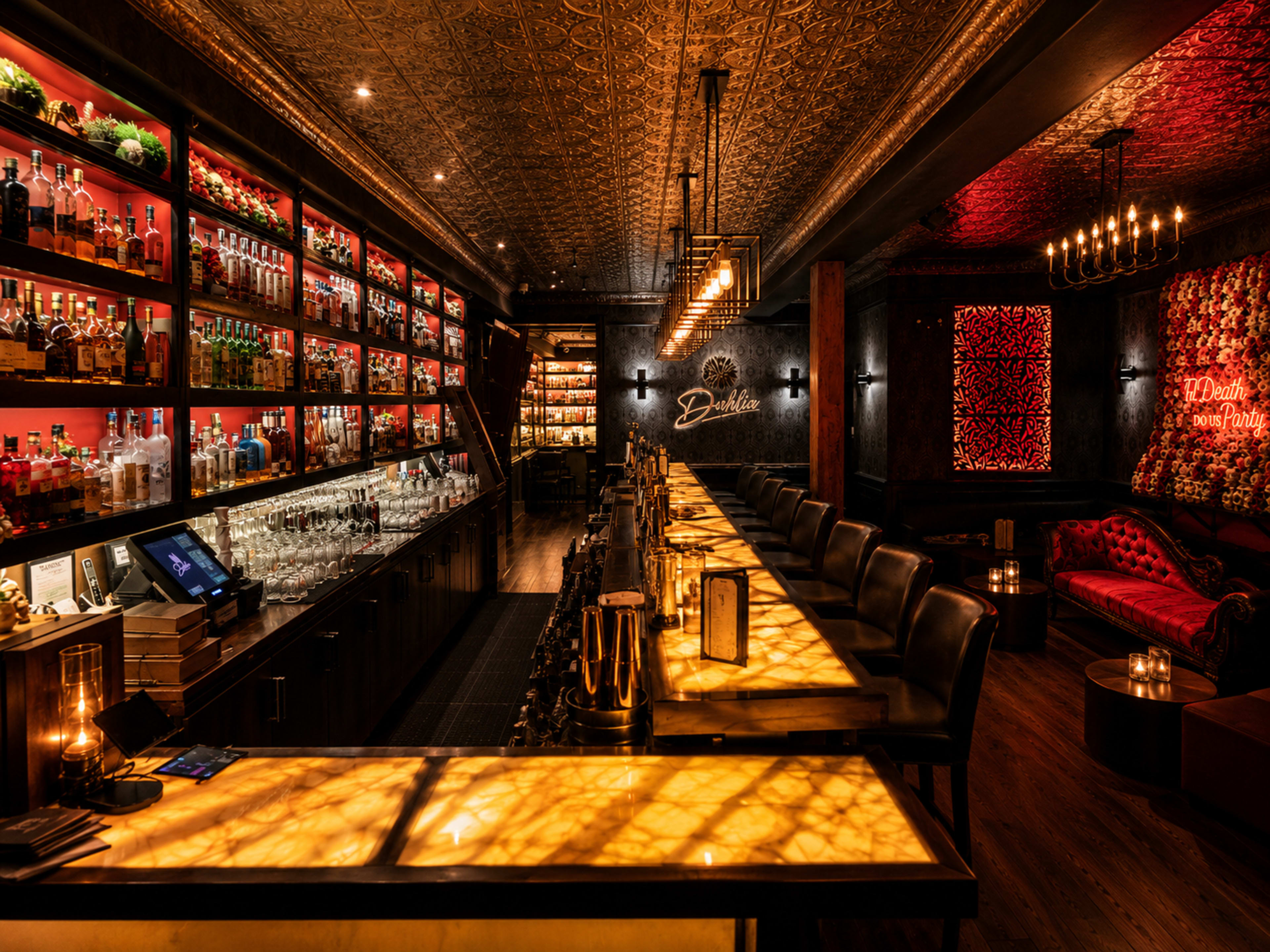 The image features an elegantly designed bar interior with illuminated shelves displaying an array of spirits and a long, glowing bar counter.