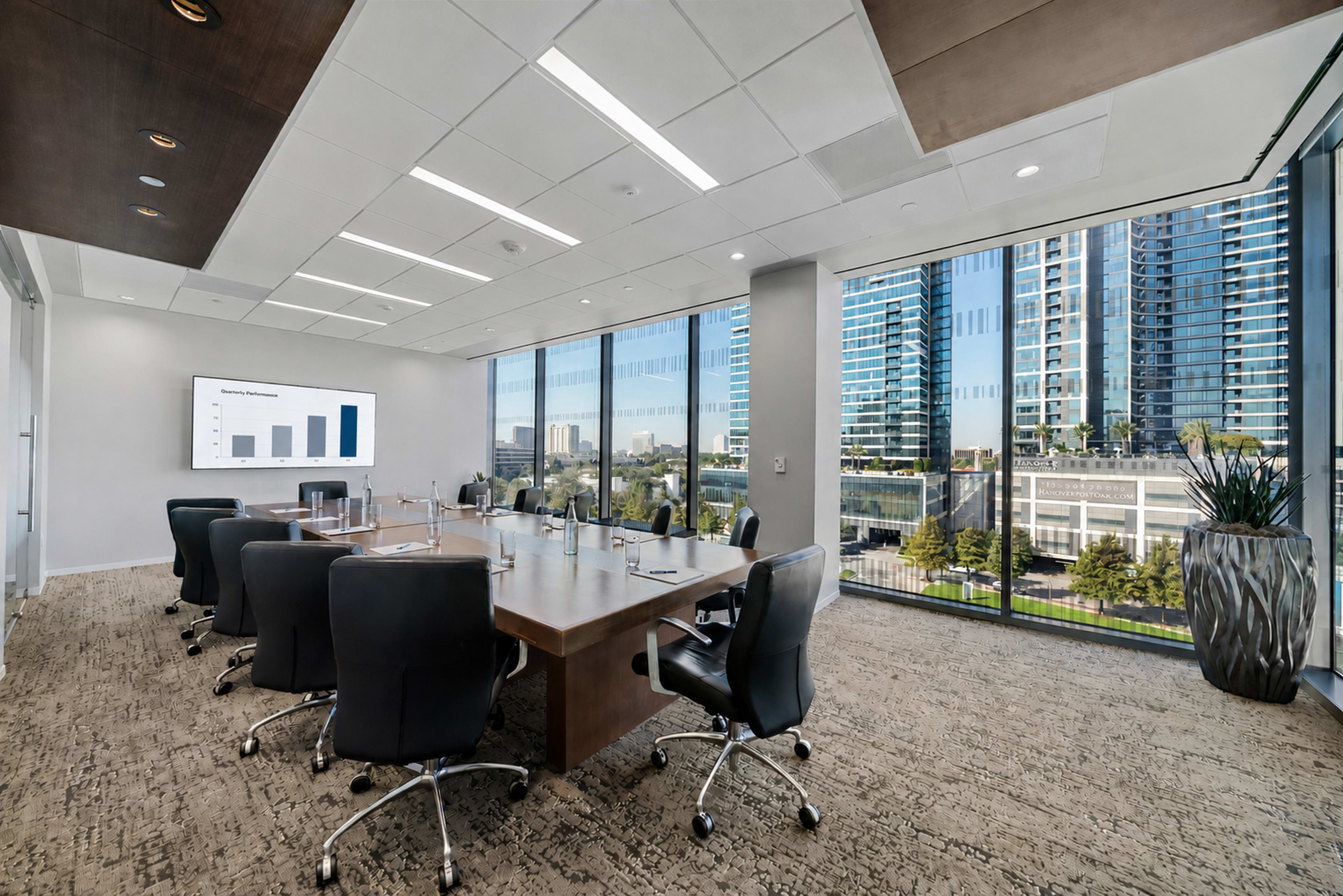A modern conference room with a large table surrounded by black chairs, featuring floor-to-ceiling windows that overlook a cityscape.