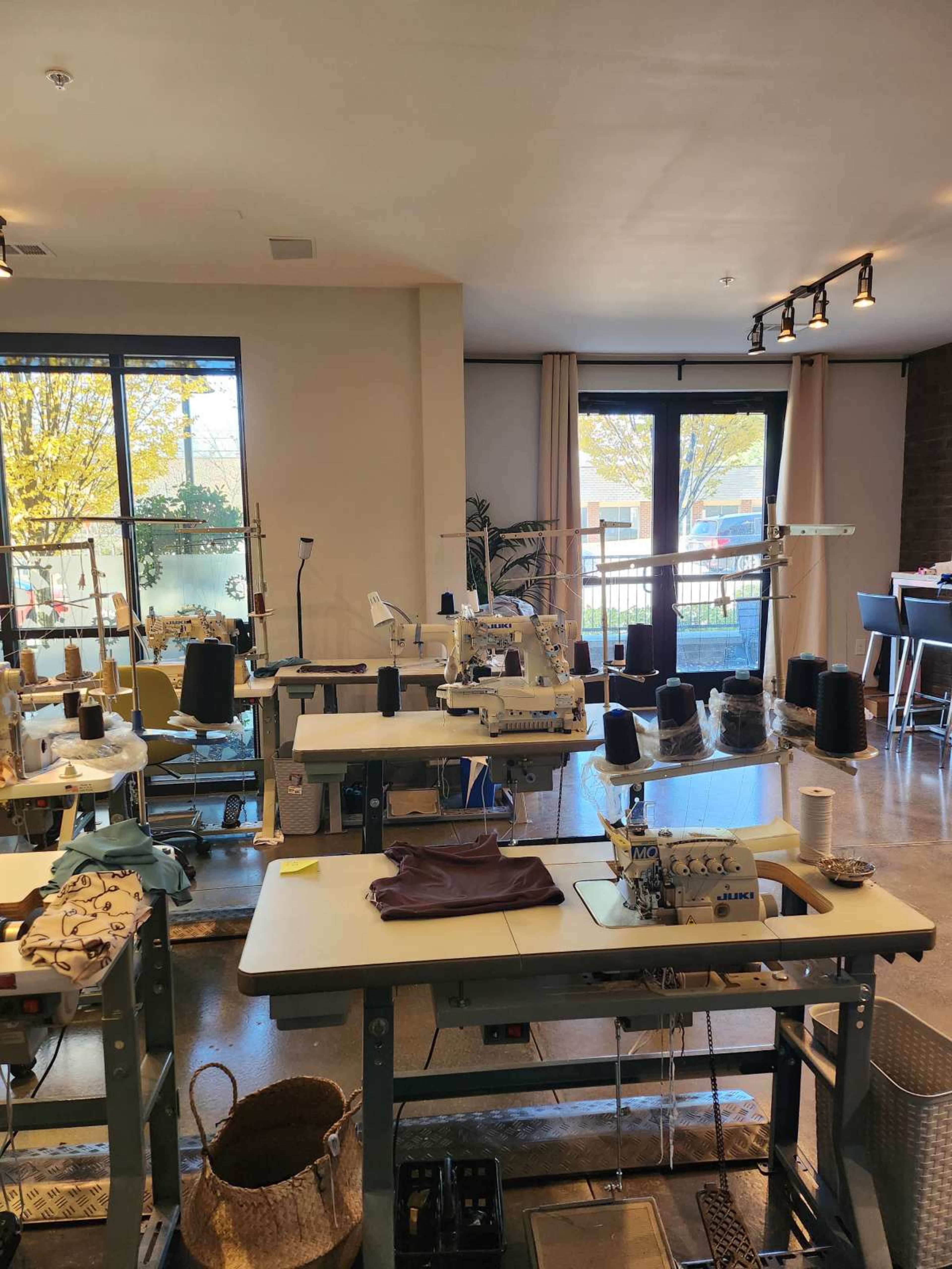 Intimate Sewing Studio with Industrial Machines & Photography Wall Image in Duluth, Duluth, GA
