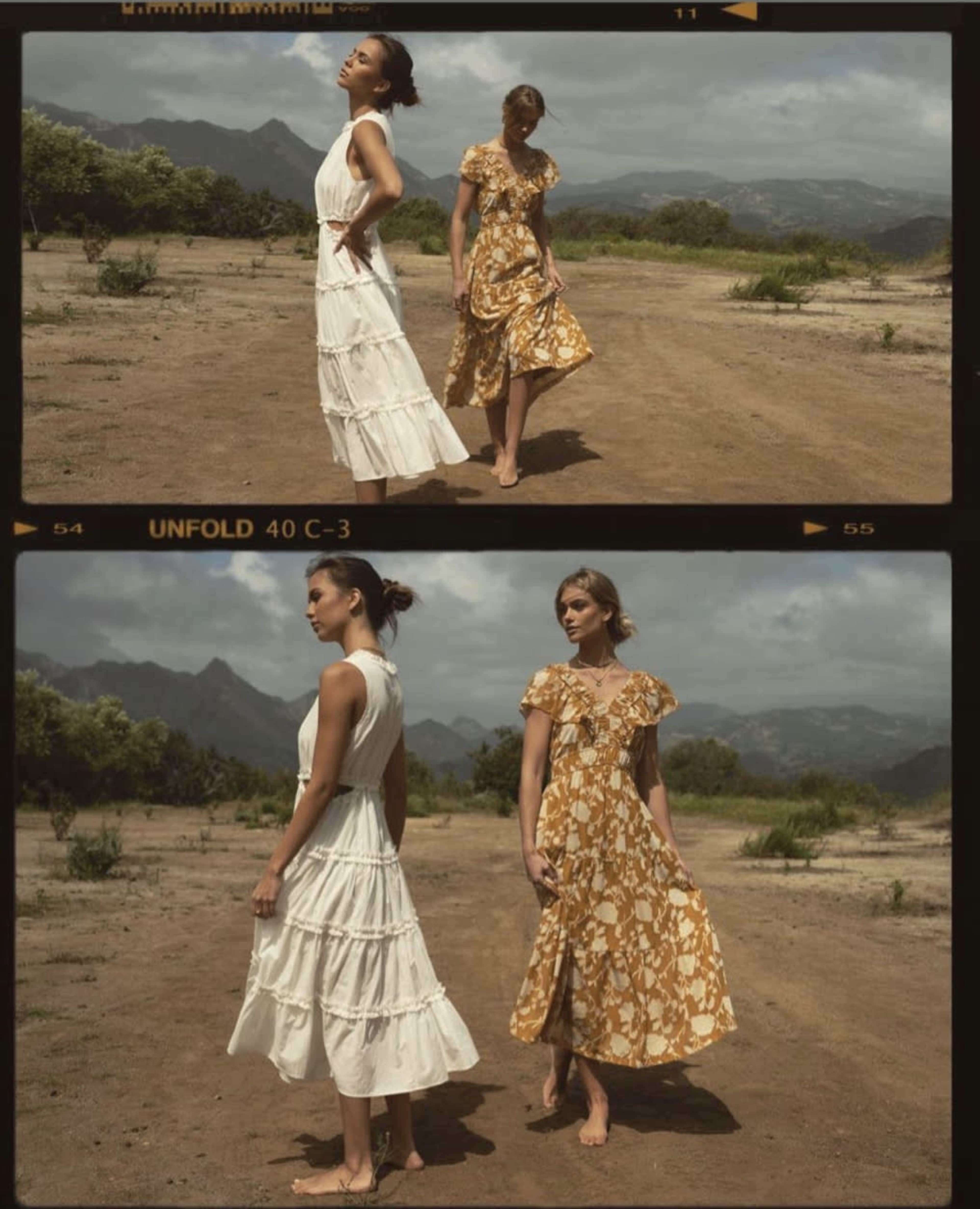Two women stand in a dry, open landscape, one in a white dress and the other in a patterned yellow dress, both facing away from each other.