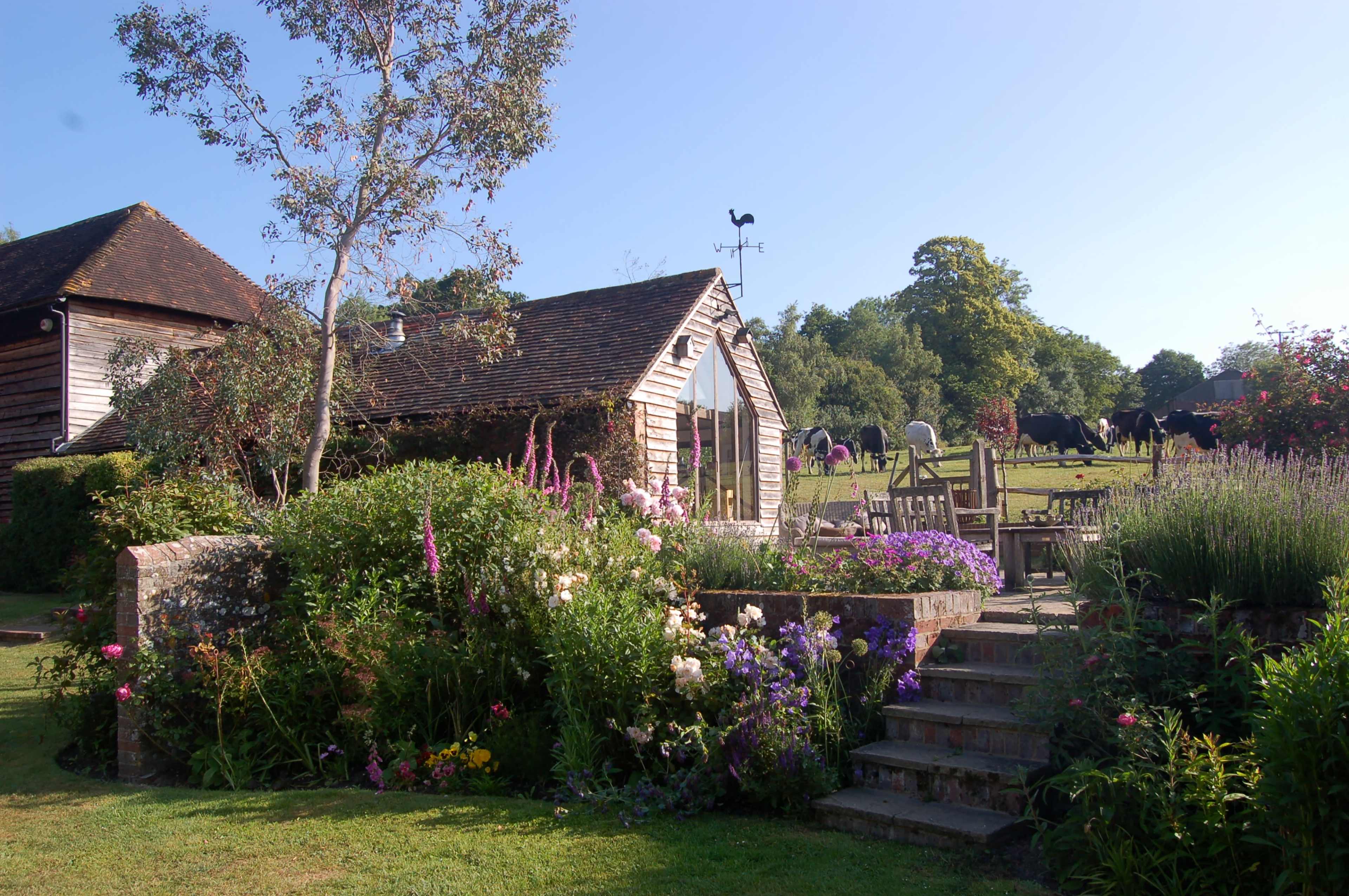 English Country Gardens with 17th century timber framed Sussex farmhouse. Image in Barcombe, Barcombe, ENG