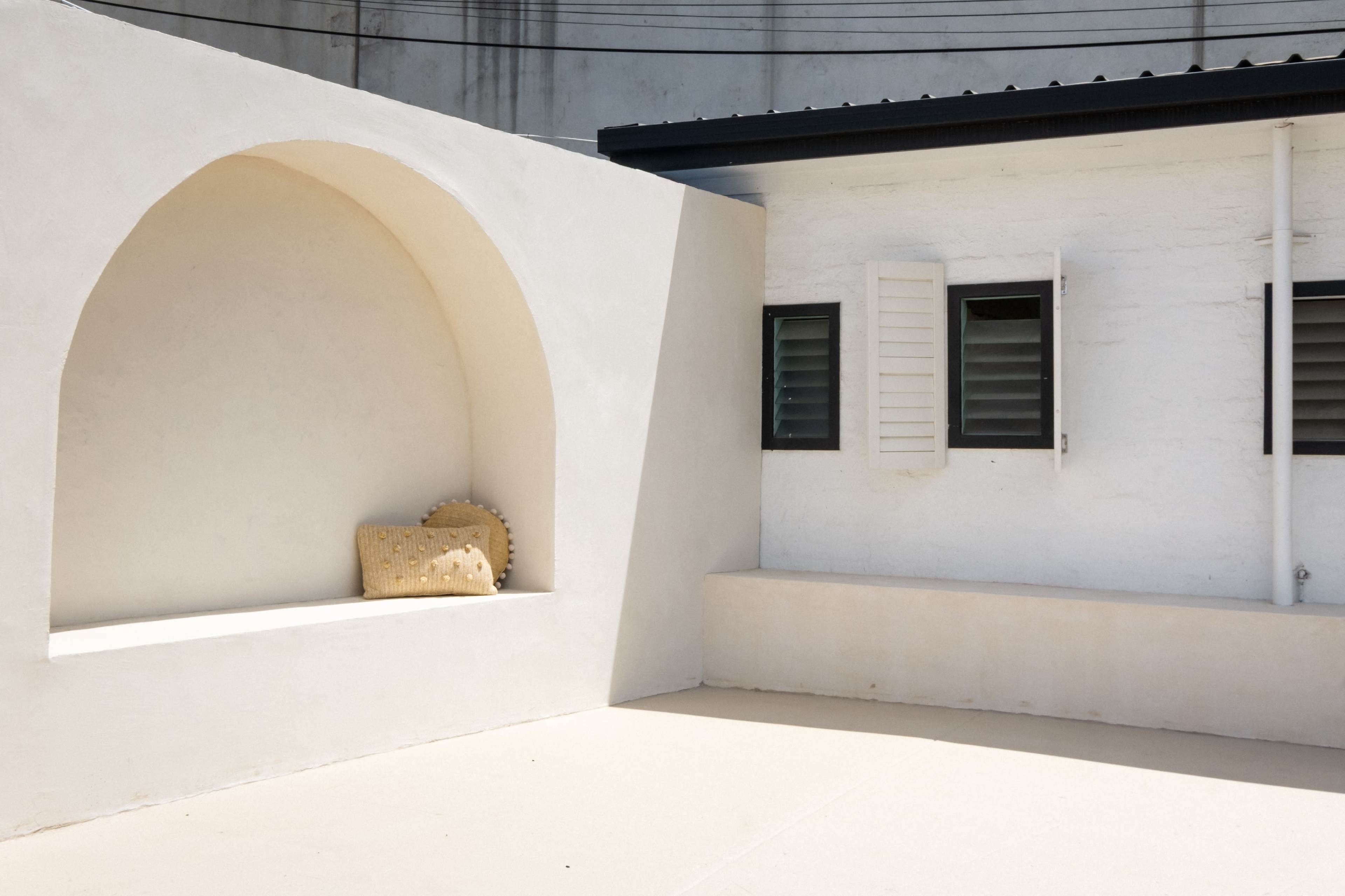 Bali-Inspired Outdoor Courtyard with Rendered Arch and Shower Image in , Airport West, VIC
