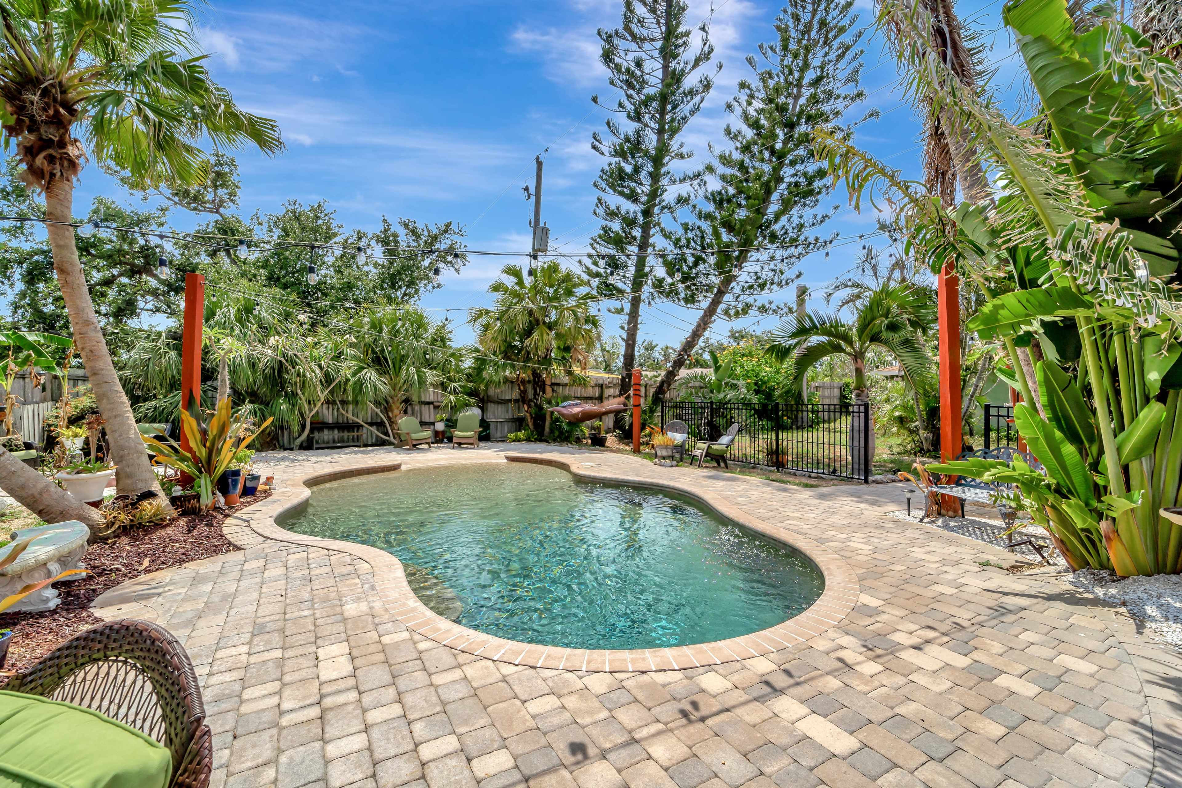 Coastal community tropical garden micro-resort w/ private lagoon pool + tiki bar + garden/dining  + outdoor kitchen Image in South Venice, South Venice, FL