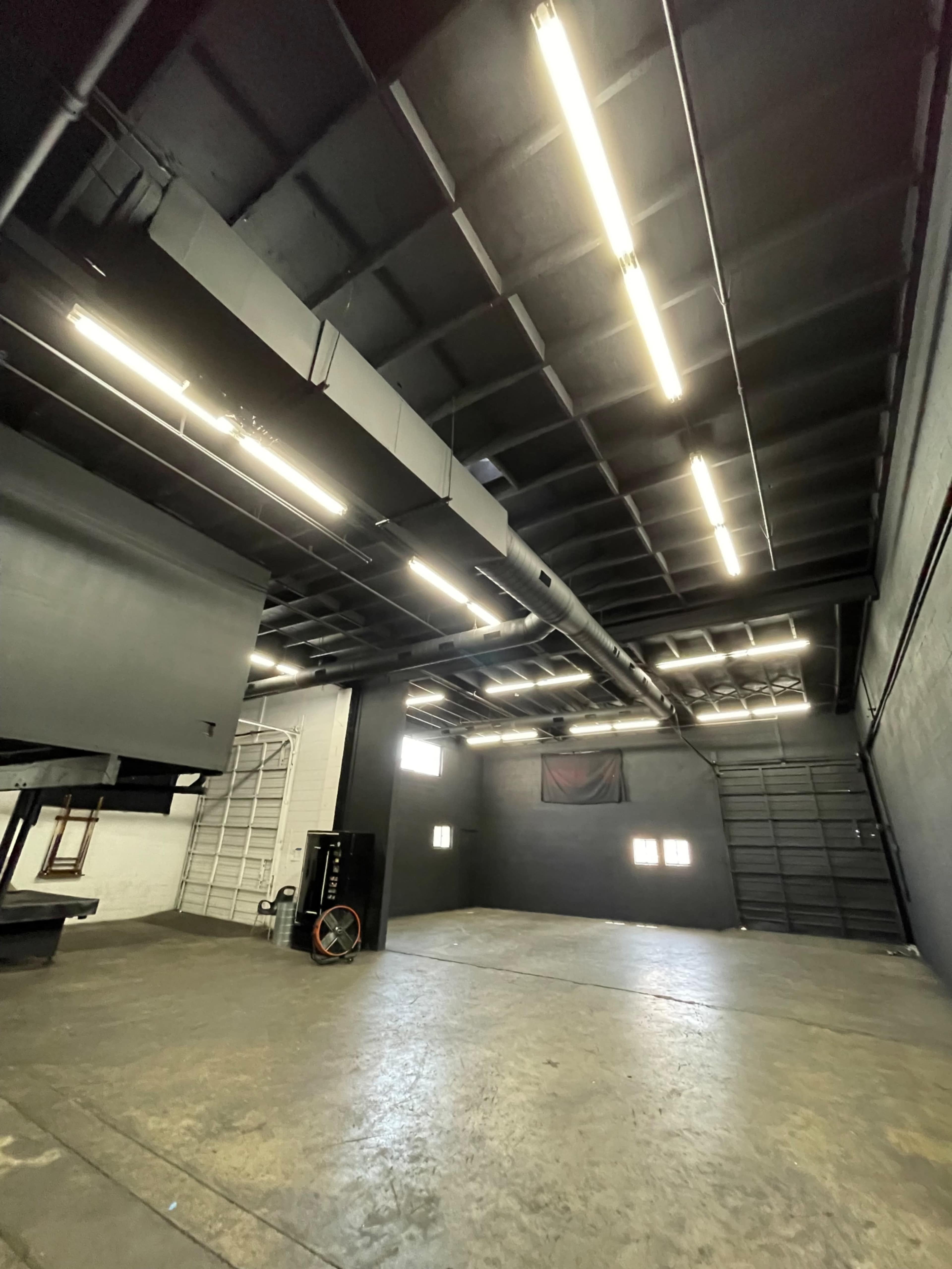 Warehouse with Black Walls,Tall Garage Doors And AC Image in South Montebello, Montebello, CA