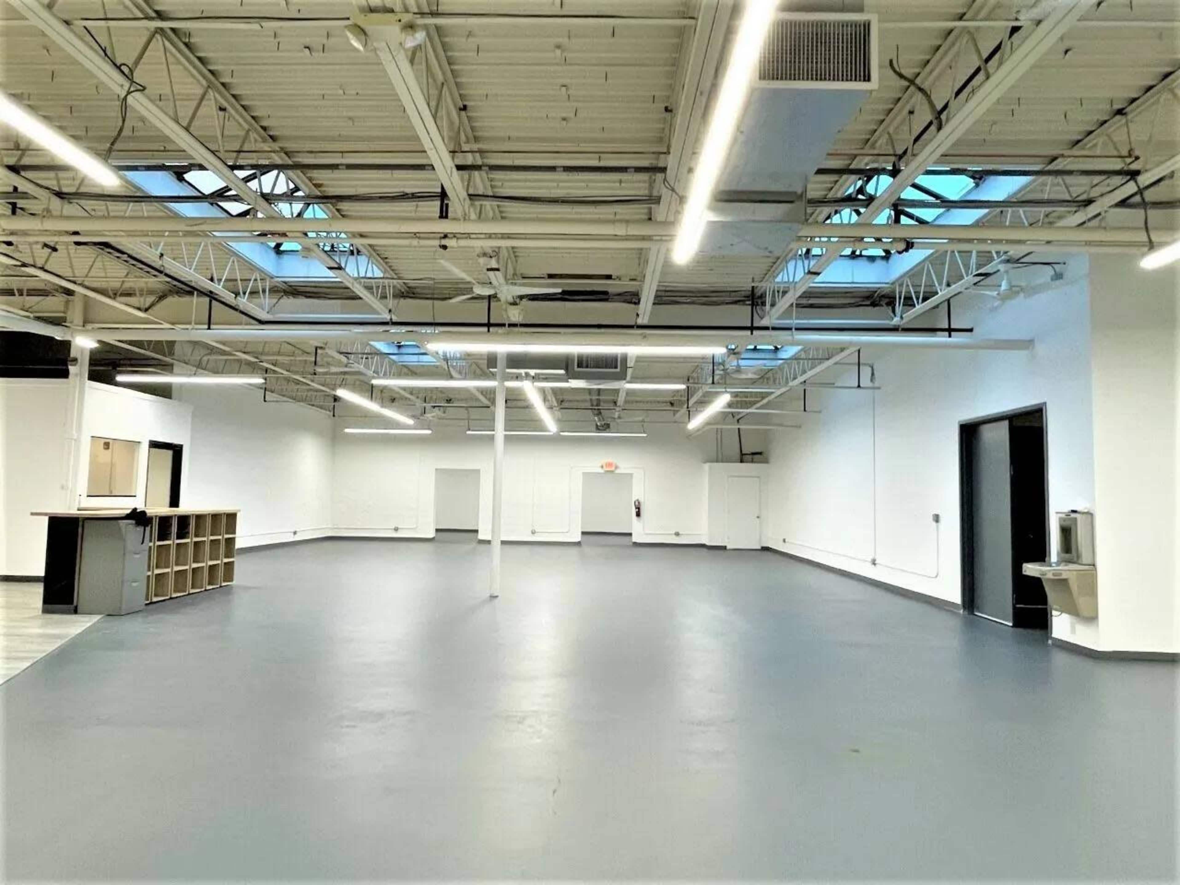 Open-Concept Industrial Hall Image in Ward Two, Somerville, MA