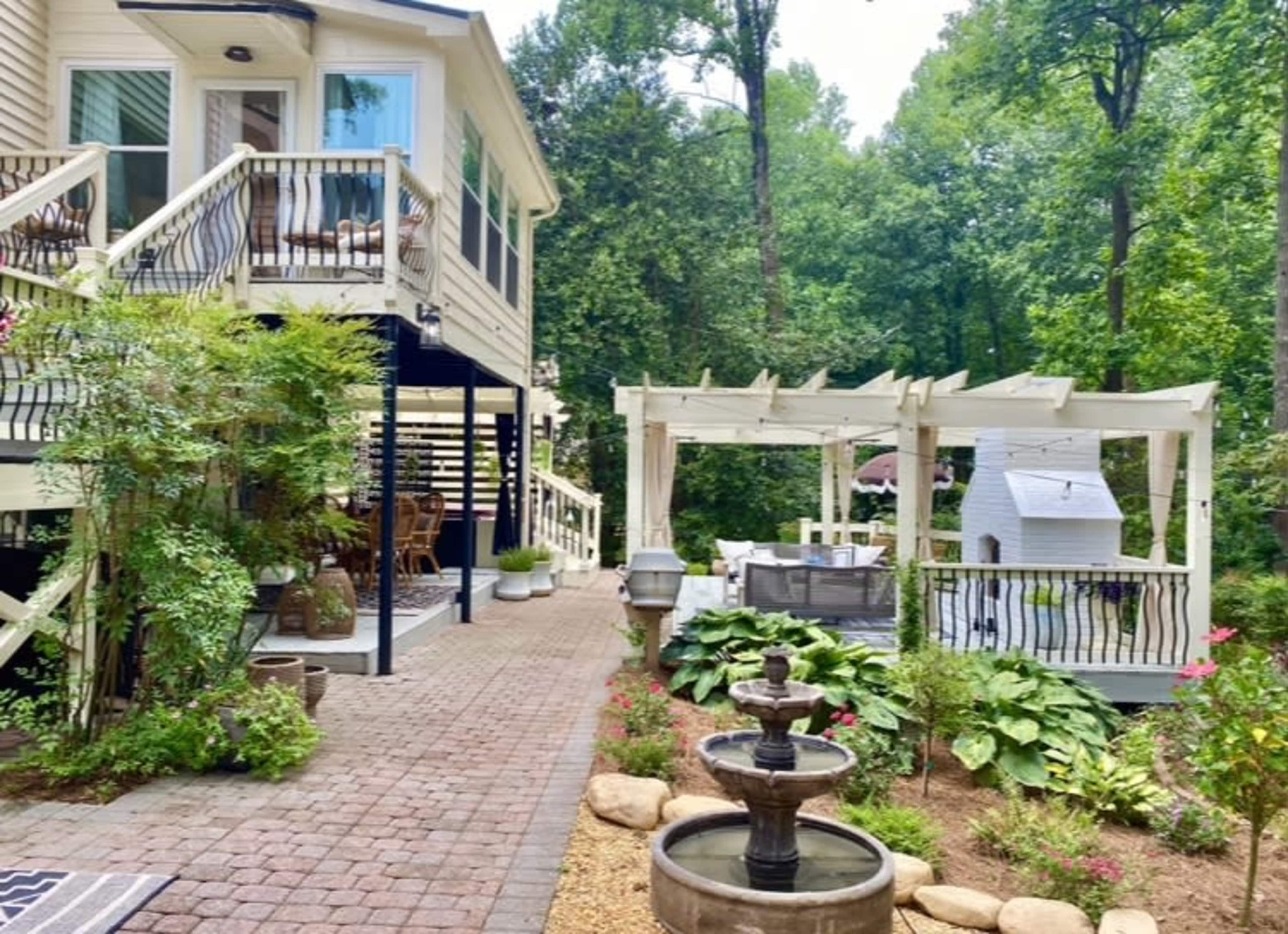 DREAM romantic backyard perfect for mini wedding, proposal, engagement reception, family gathering. Multiple seating areas, outdoor fireplace, library Irish Pub, Art studio and more! Image in , Duluth, GA