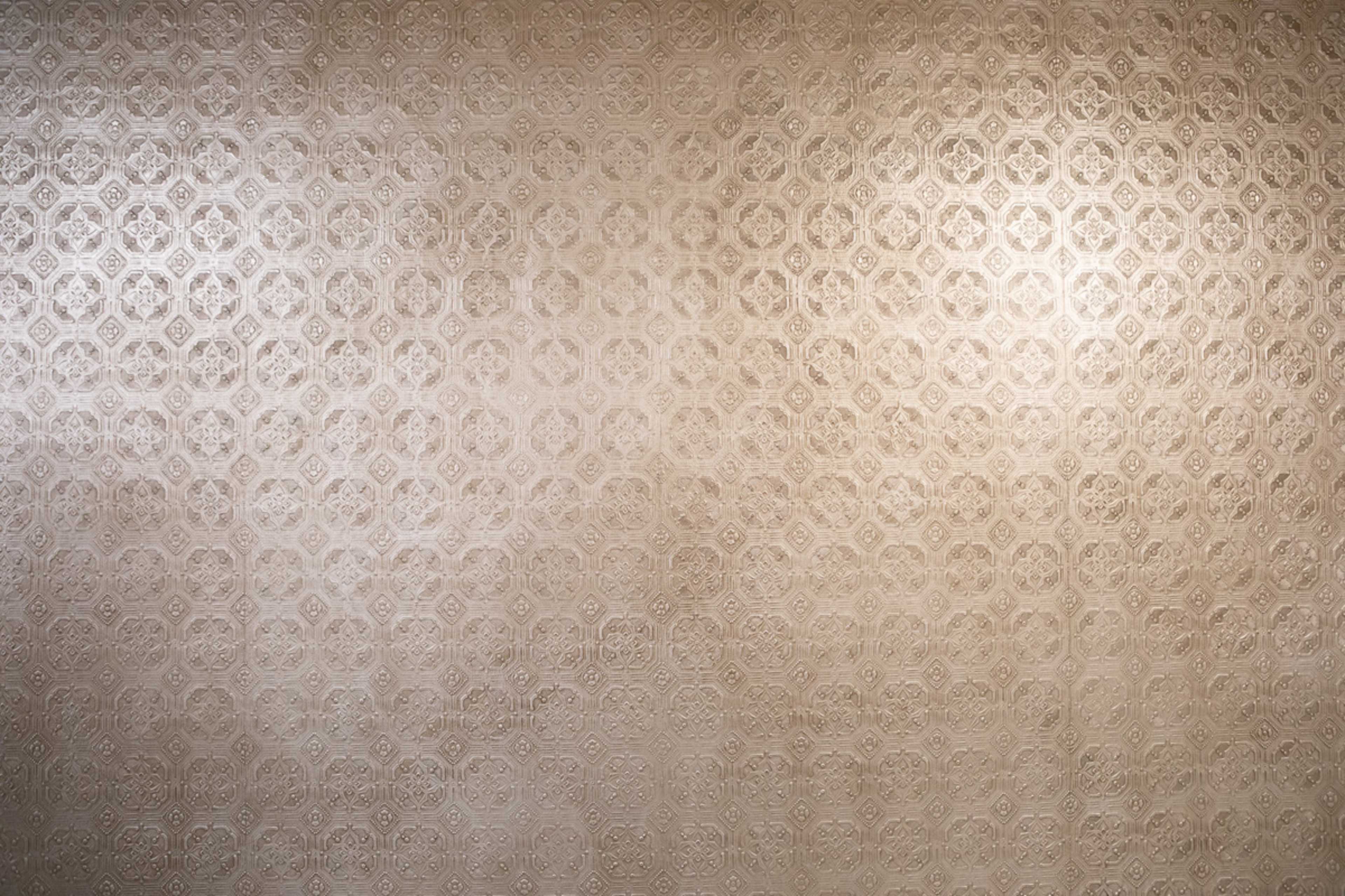 A textured wall covered in a repeating hexagonal pattern.