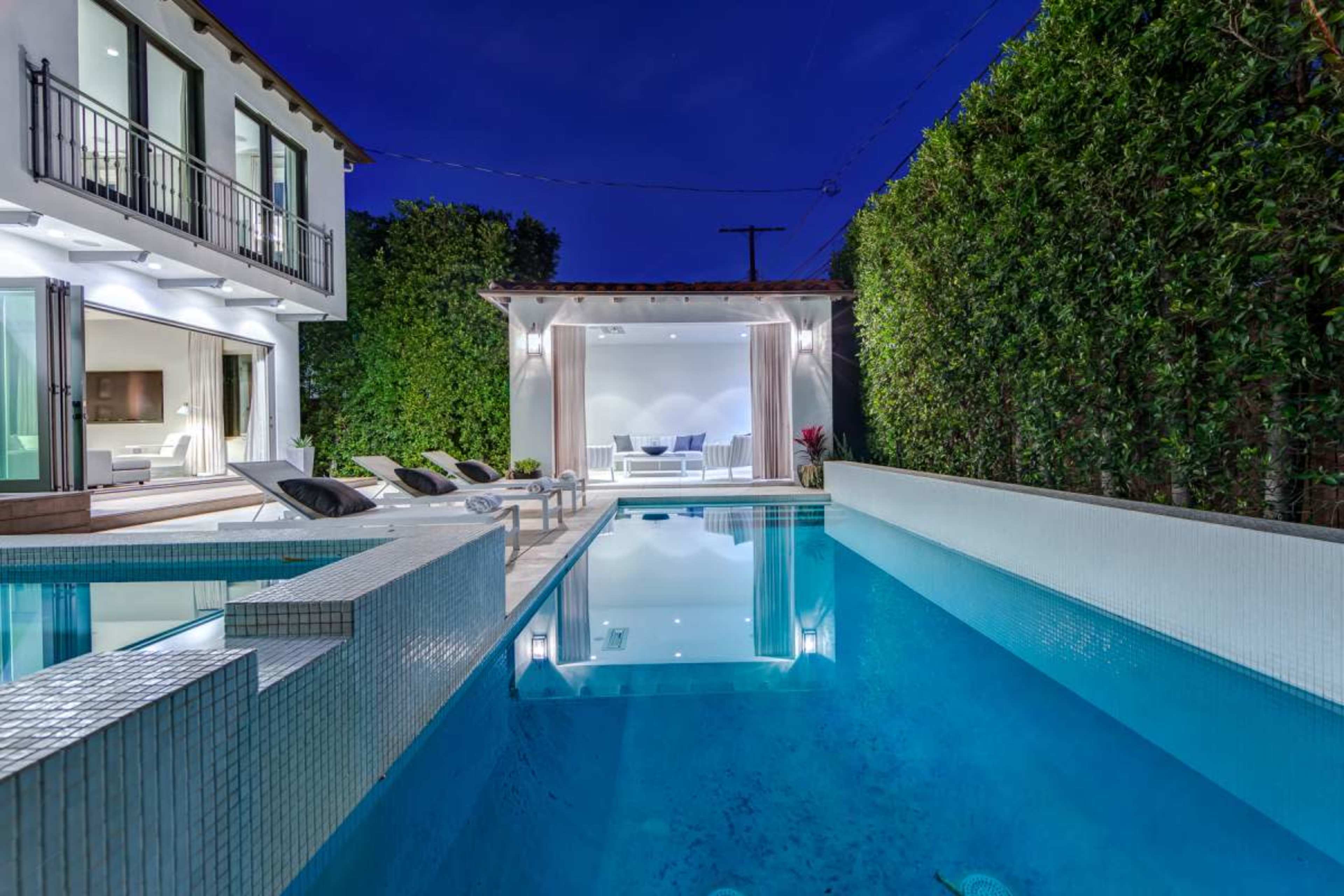 West Hollywood Mediterranean home with cabana and pool. Front Italian style fountain and olive tree courtyard. Image in Beverly Grove, West Hollywood, CA