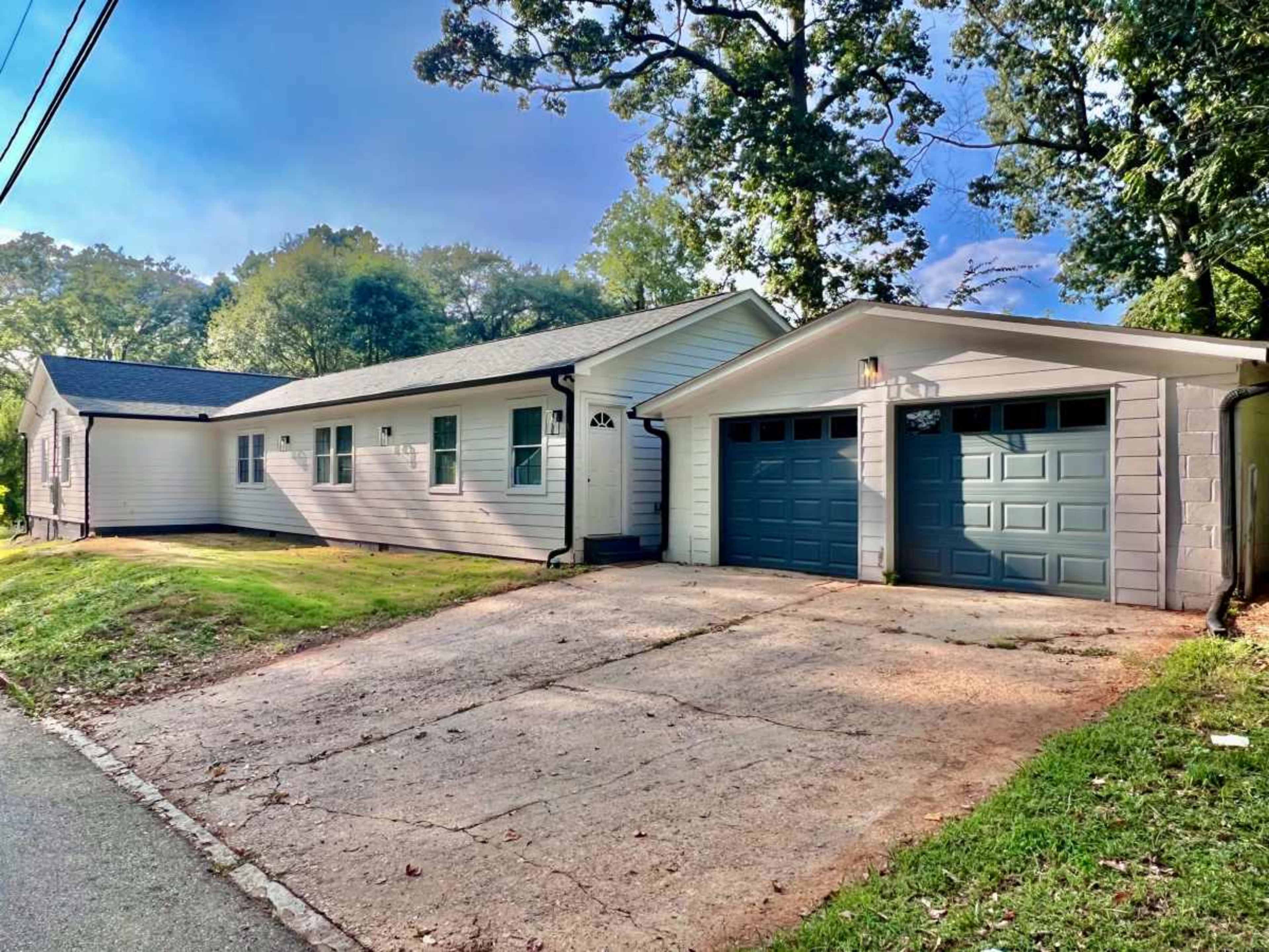 Spacious elegance meets modern convenience in this expansive single-level home. Image in Oakland City, Atlanta, GA