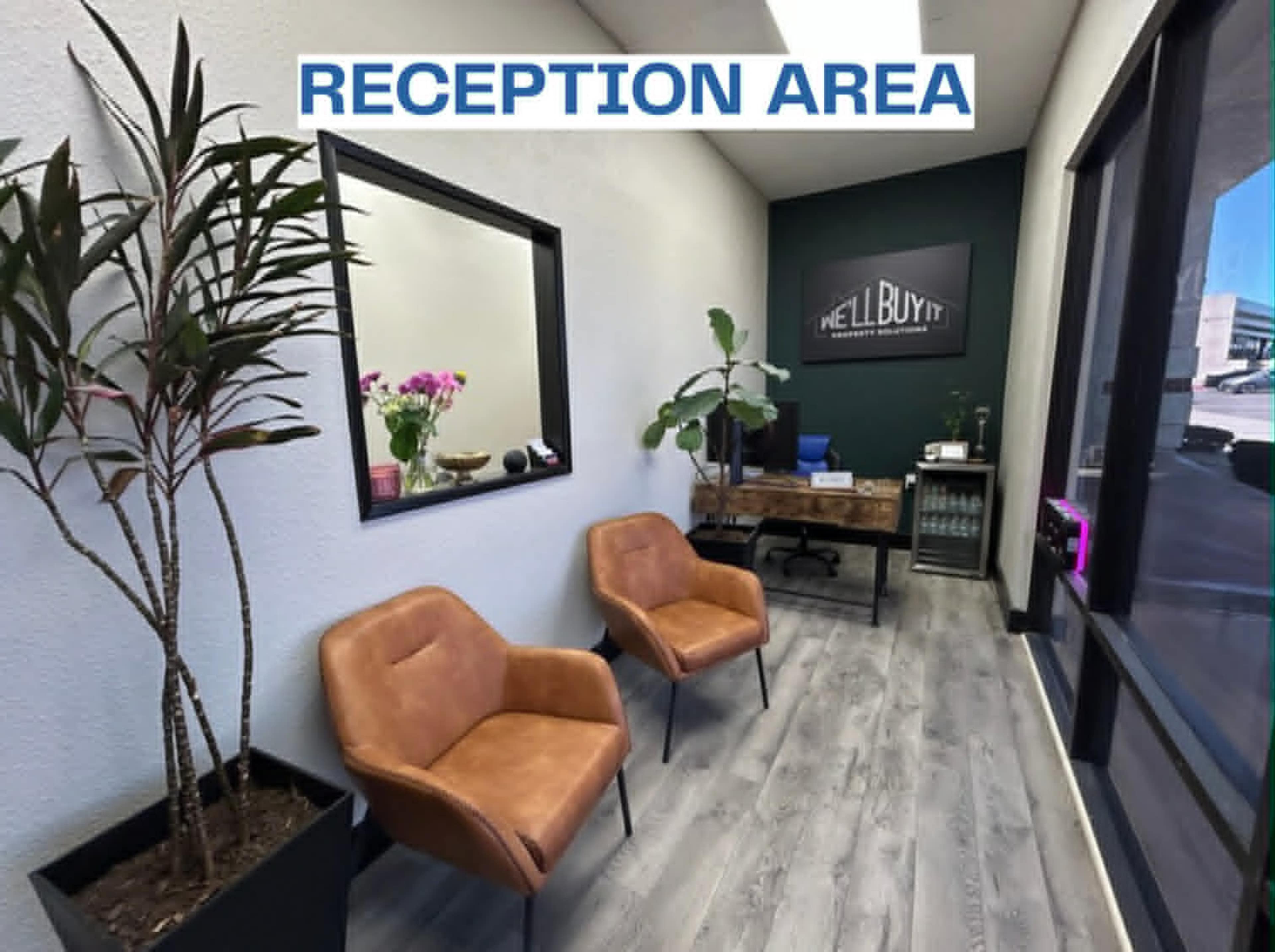 The image shows a reception area with two brown chairs, a desk, a potted plant, and a window allowing natural light.