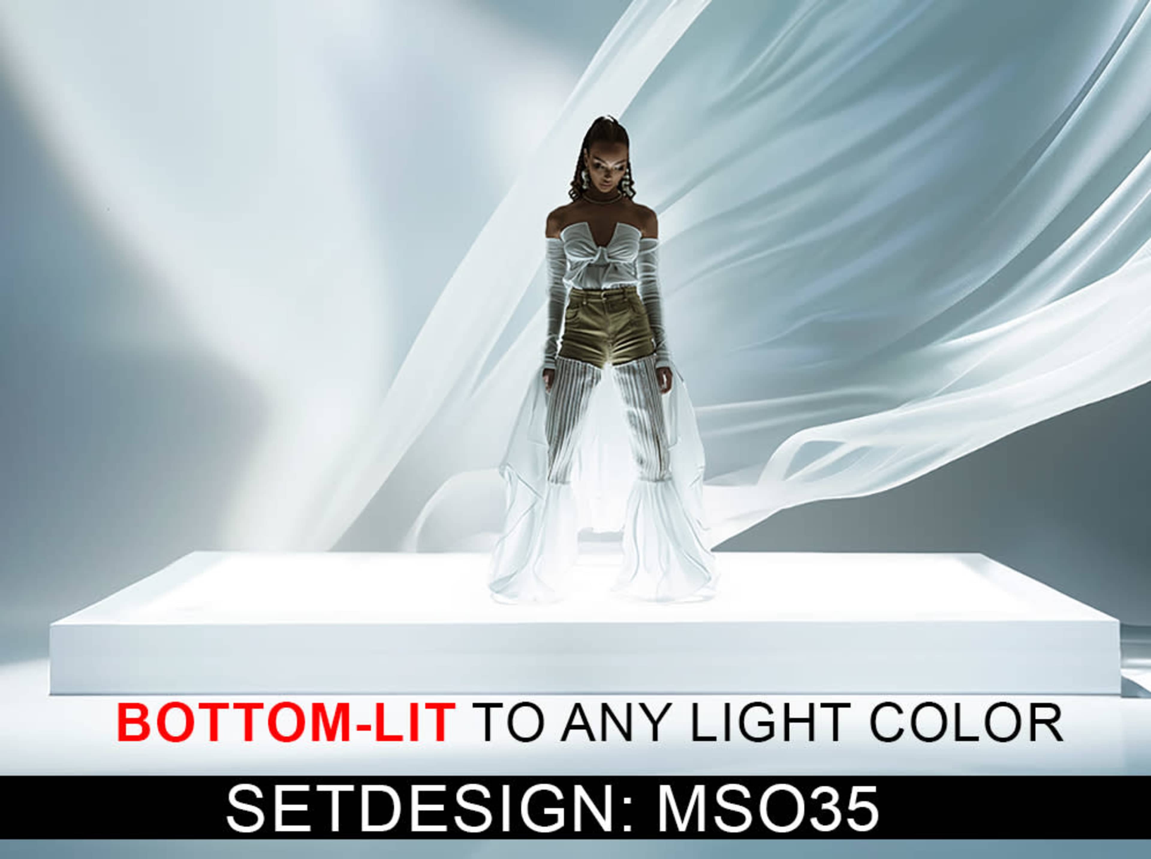 A model stands on a illuminated platform draped with flowing fabric.