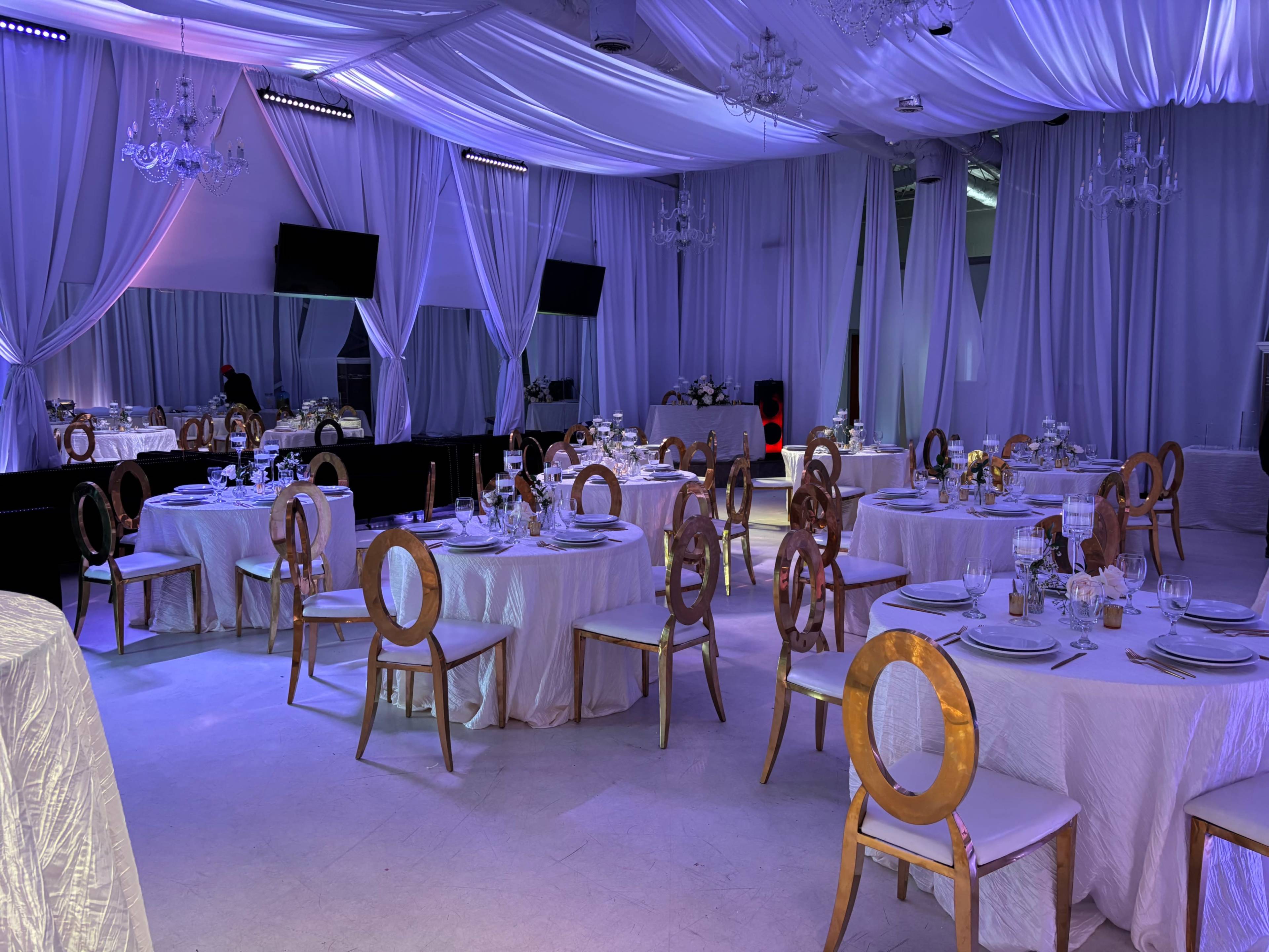 Fully Draped Midtown Lounge & Dinner Party Room with Chandeliers and Uplighting Image in Buckhead, Atlanta, GA