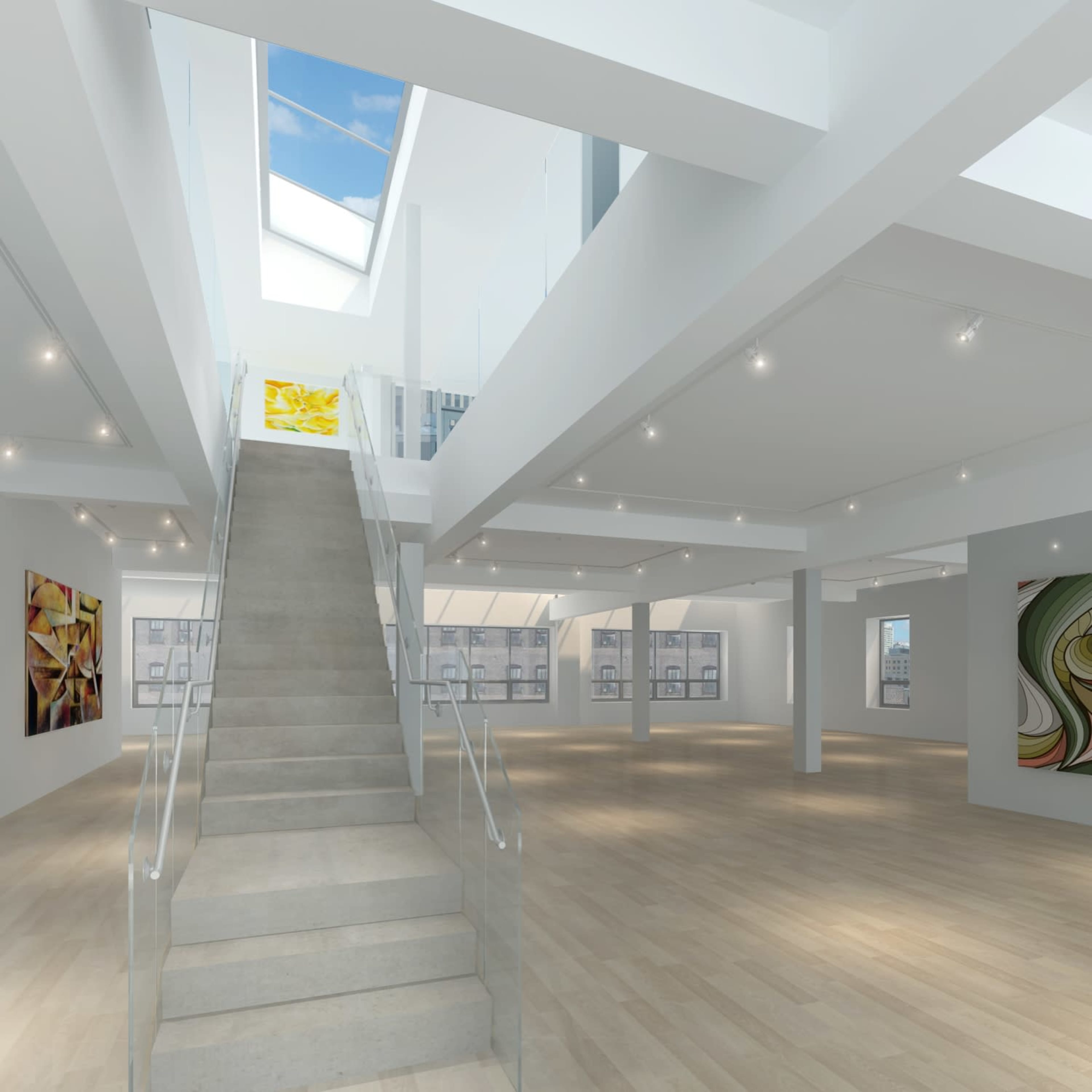 The image shows a spacious, modern art gallery with a staircase leading to a second level and large windows allowing natural light to enter.