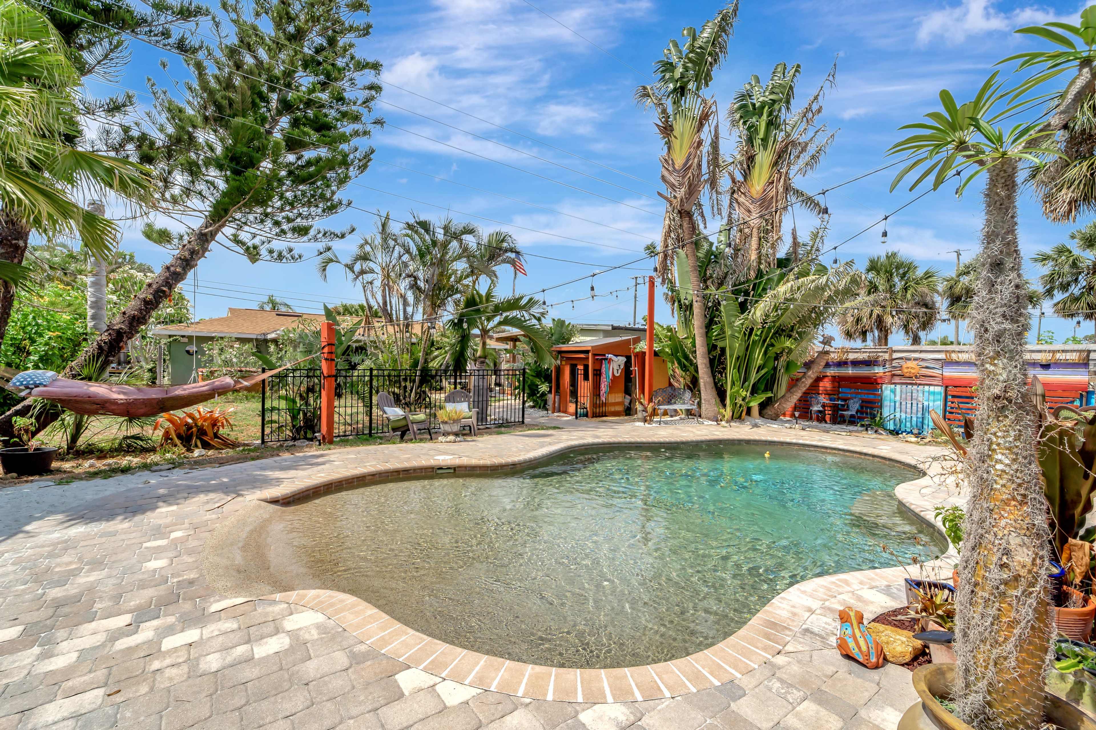 Coastal community tropical garden micro-resort w/ private lagoon pool + tiki bar + garden/dining  + outdoor kitchen Image in South Venice, South Venice, FL