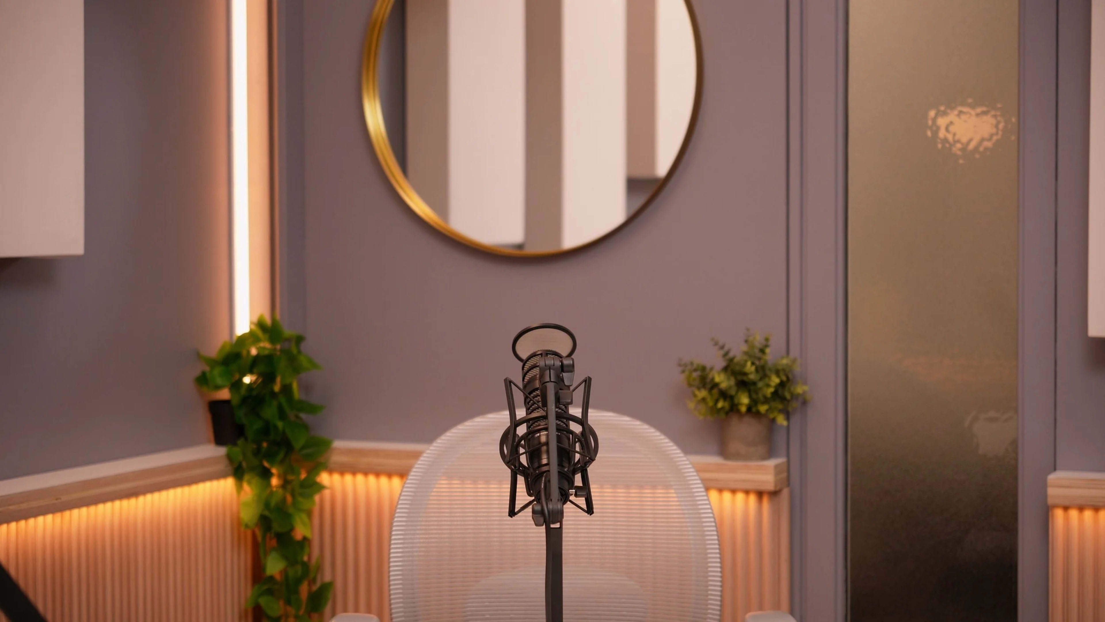 A microphone stands in front of a circular mirror, surrounded by plants and softly lit walls.