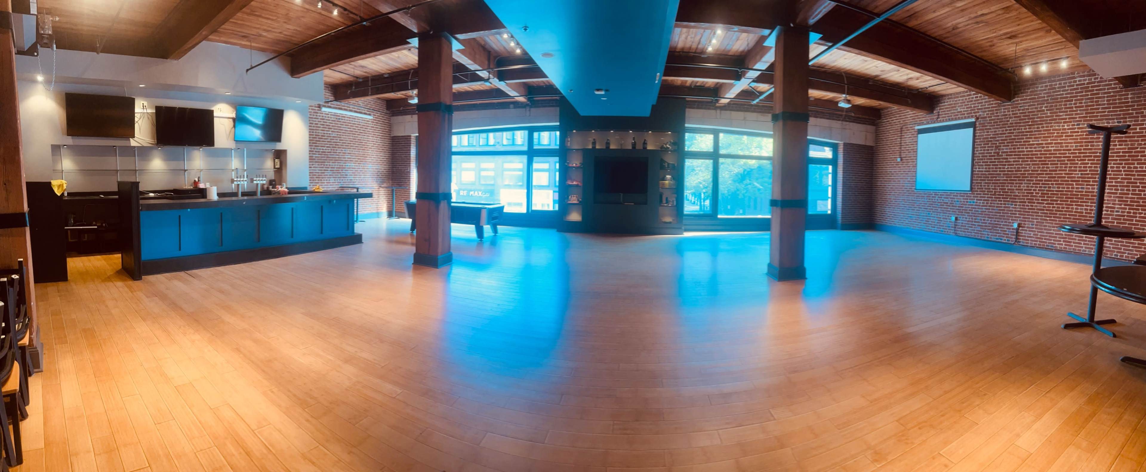 Downtown Event Space with bar and Large windows with view of Washington Ave Image in Downtown West, St. Louis, MO
