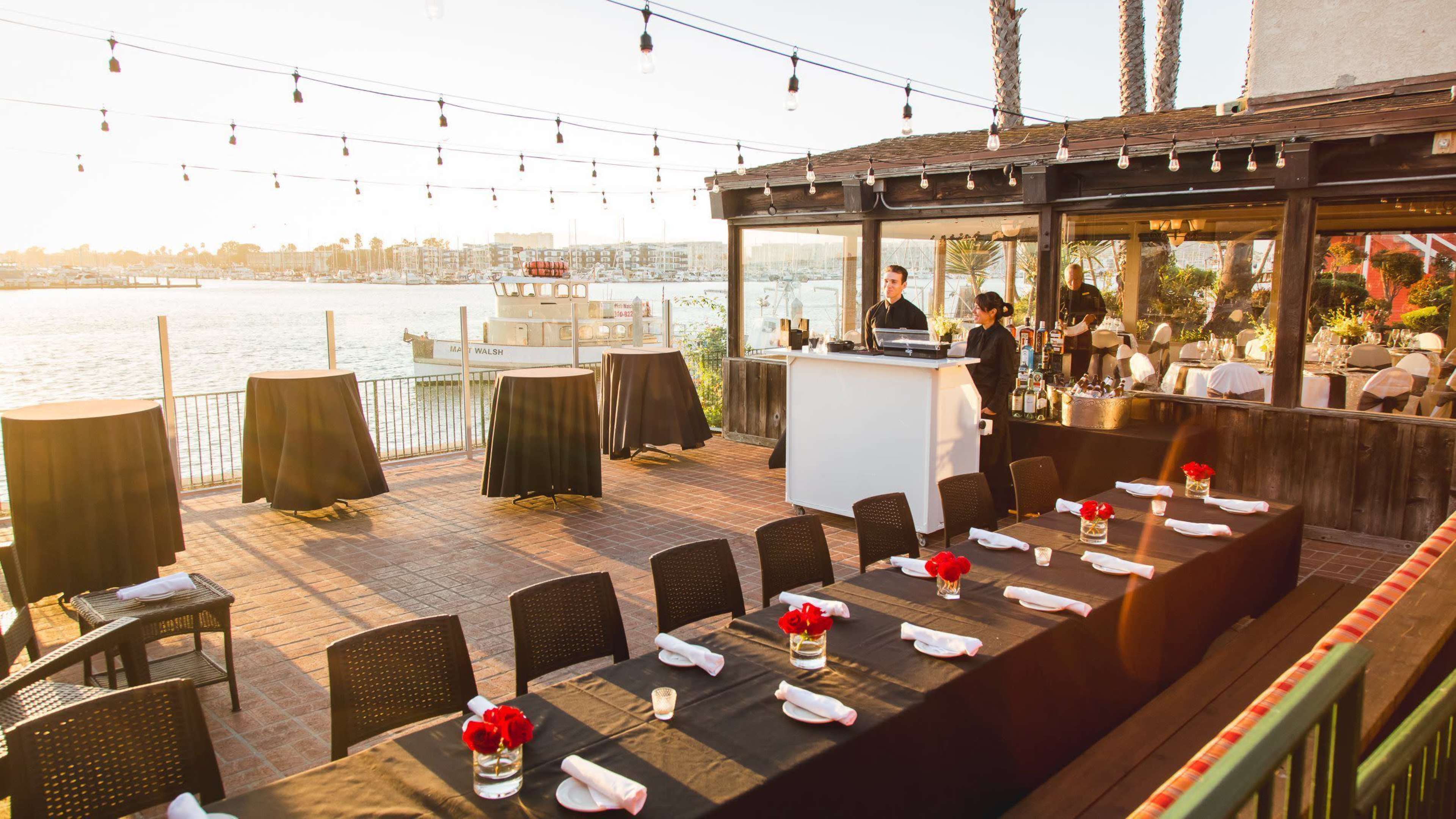 Waterfront Restaurant with Expansive Patio Featuring Views of Sparkling Water, Yachts, and Sealife Image in Marina del Rey, Marina Del Rey, CA