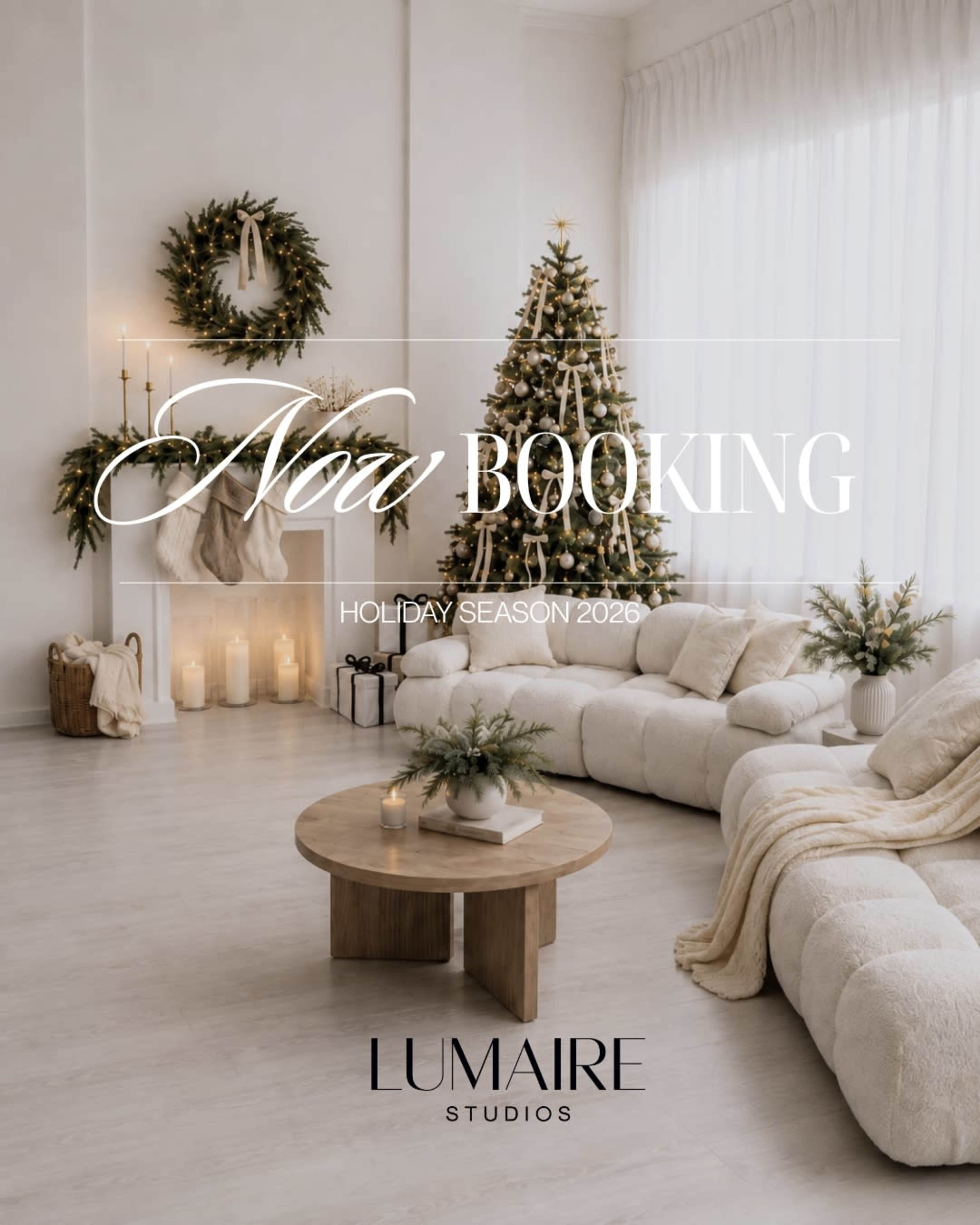 The image features a cozy living room decorated for the holiday season, with a large, plush sofa, a wooden coffee table, and festive greenery.