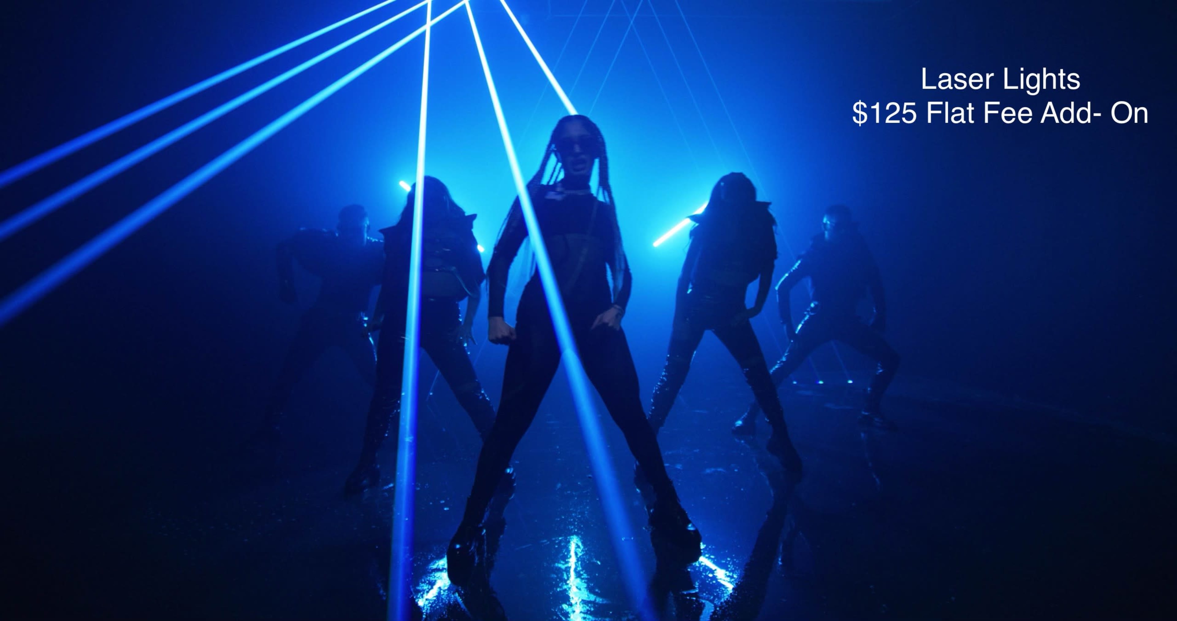 A group of dancers performs under blue laser lights in a dimly lit space.