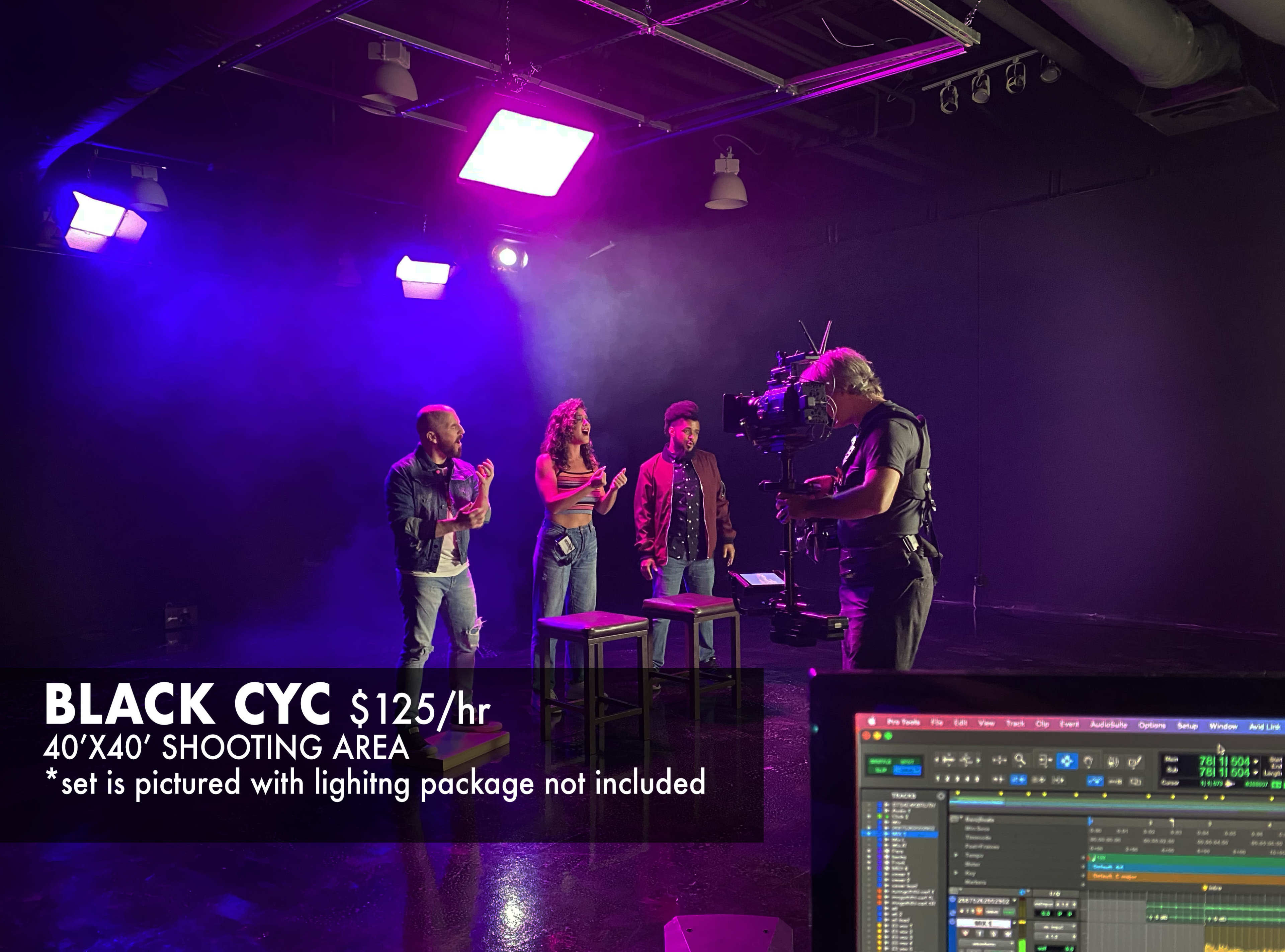 A camera crew films three actors in a black cyc studio with purple lighting and three stools.